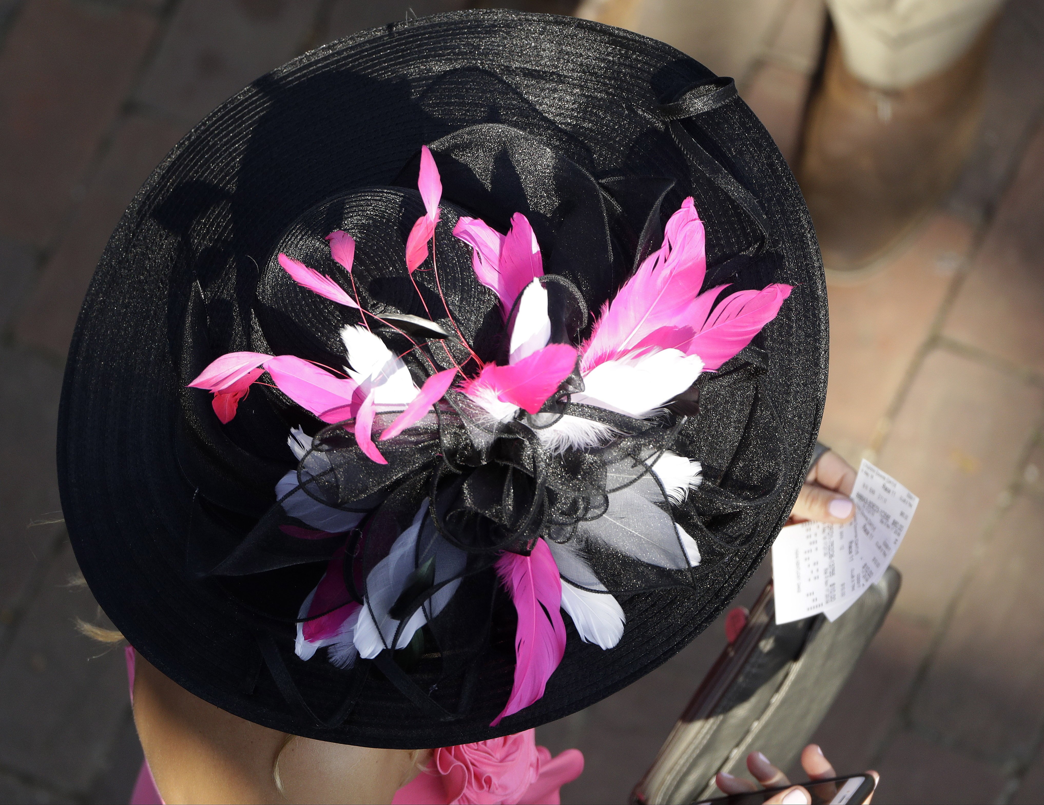 Woman with a hat during the 142nd running of the Kentucky Oaks horse race at Churchill Downs on May 7, 2016, in Louisville, Ky.