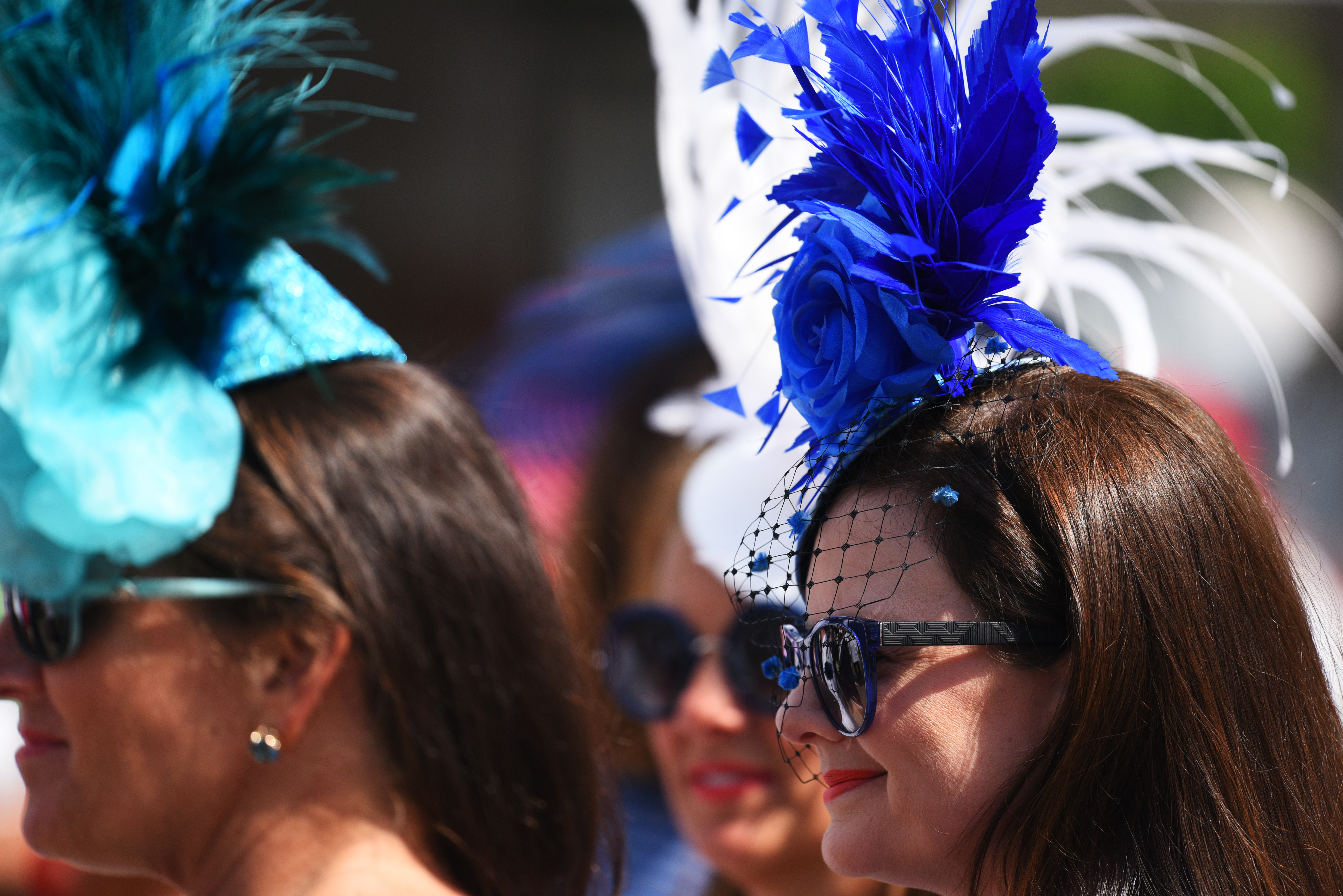 Women with hats during the 142nd running of the Kentucky Oaks horse race at Churchill Downs on May 7, 2016, in Louisville, Ky.