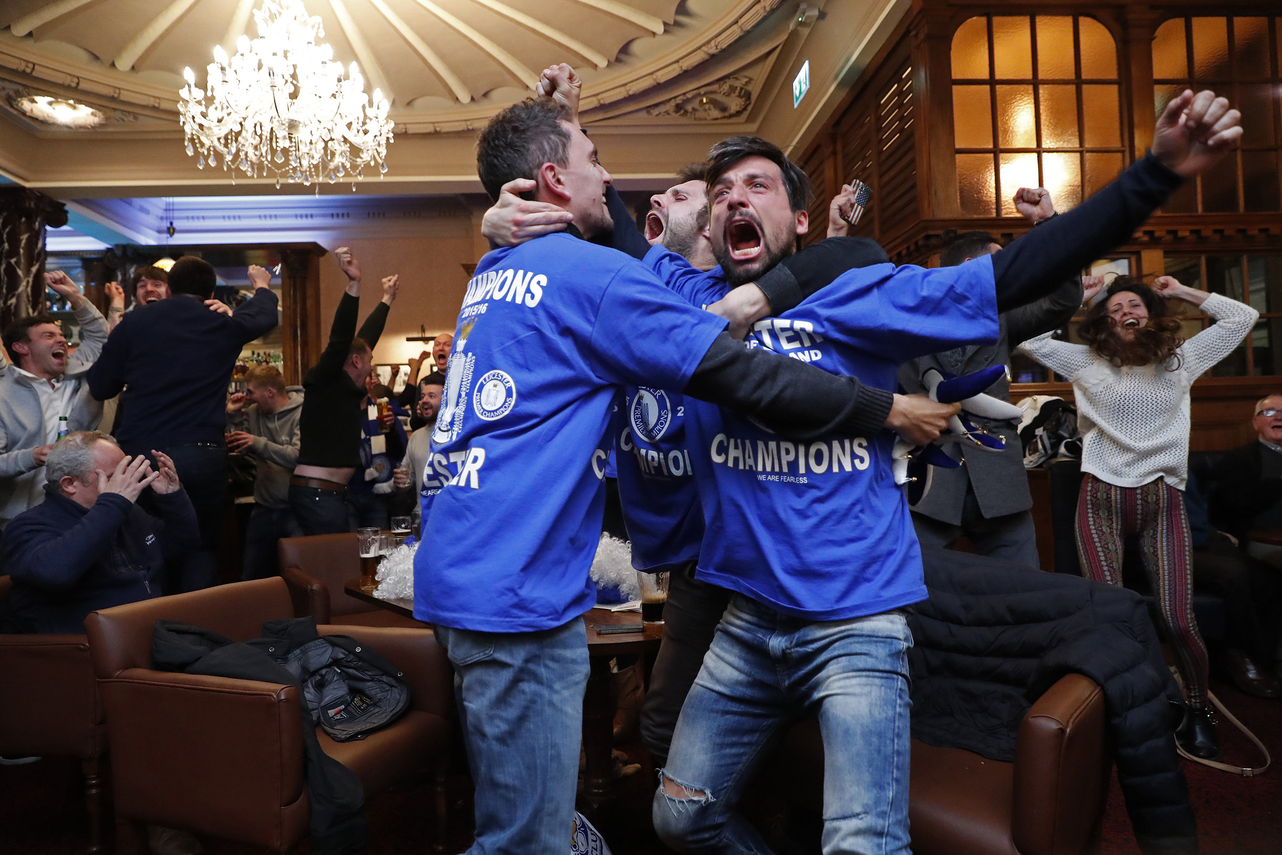Leicester City fans celebrate after Chelsea's second goal against Tottenham Hotspur at a pub in Leicester, eastern England, May 2, 2016. (Eddie Keogh—Reuters)