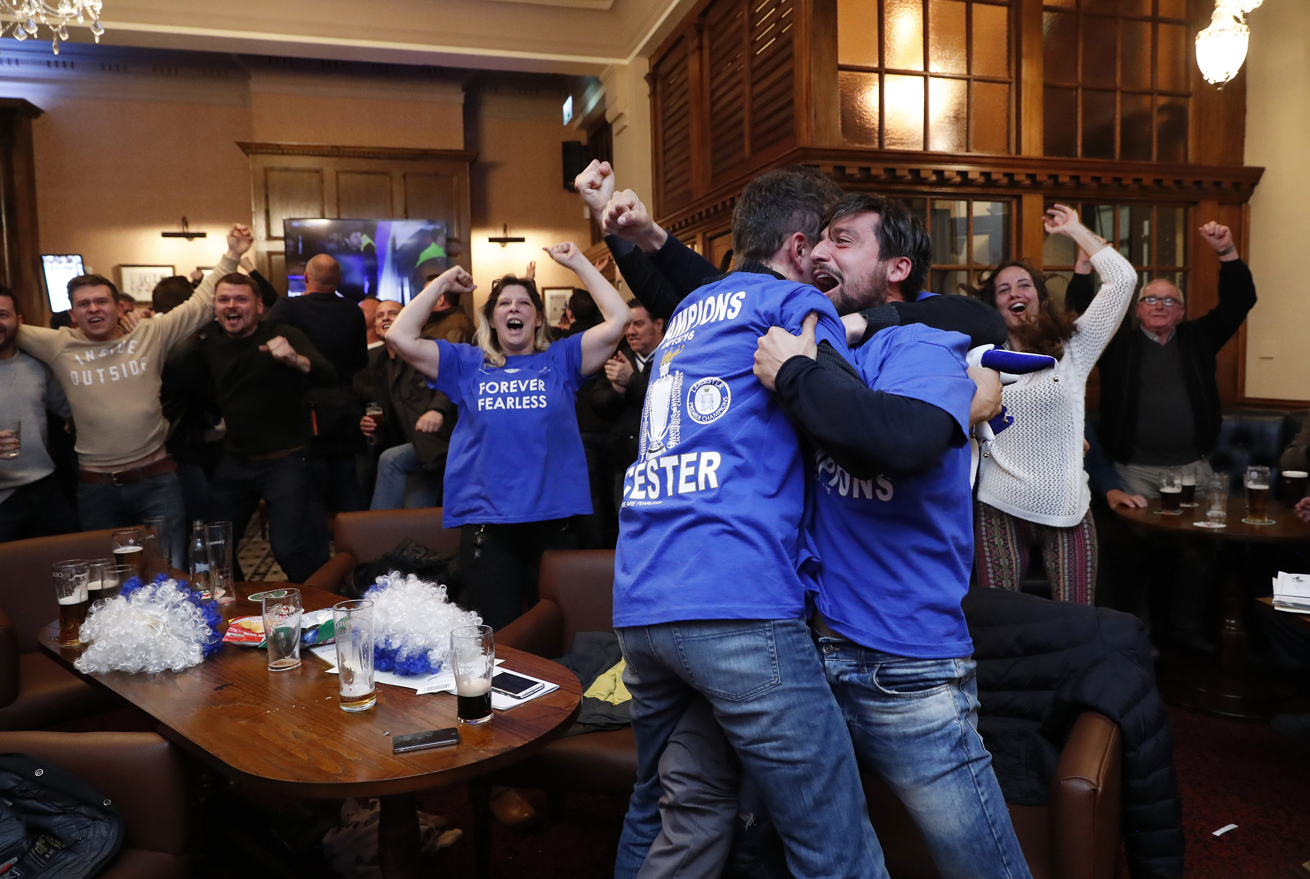Leicester City fans celebrate after Chelsea's second goal against Tottenham Hotspur at a pub in Leicester, eastern England, May 2, 2016. (Eddie Keogh—Reuters)