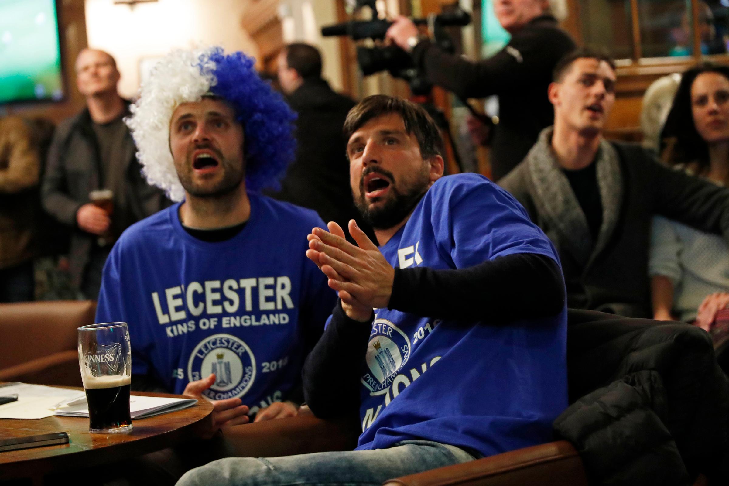 Leicester City fans watch the English Premier League match between Chelsea and Tottenham Hotspur at a pub in Leicester, eastern England, May 2, 2016.