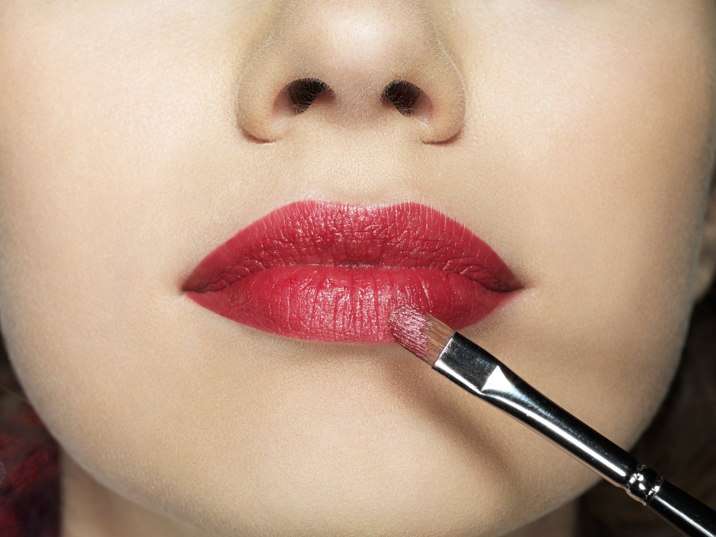 Close up of lipstick application