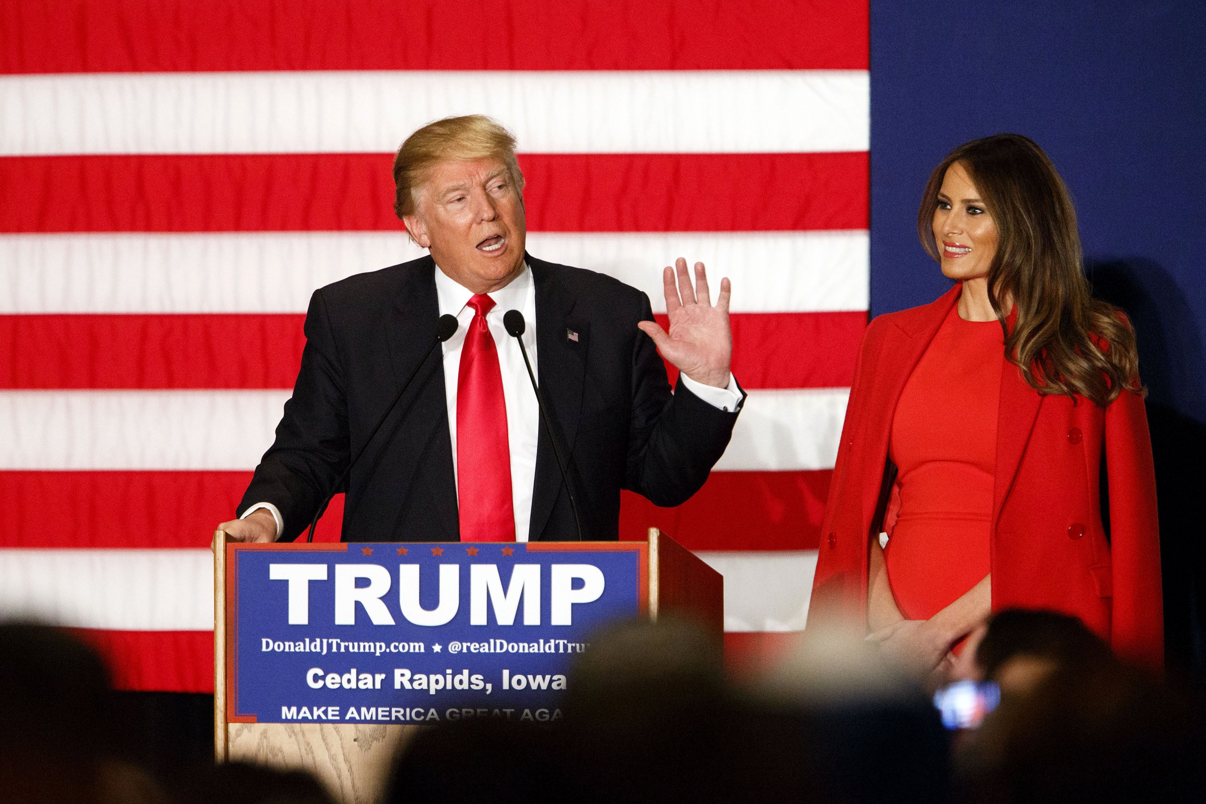 Donald Trump, president and chief executive of Trump Organization Inc. and 2016 Republican presidential candidate, left, speaks as wife Melania Trump listens during a campaign event in Cedar Rapids, Iowa, U.S., on Monday, Feb. 1, 2016.