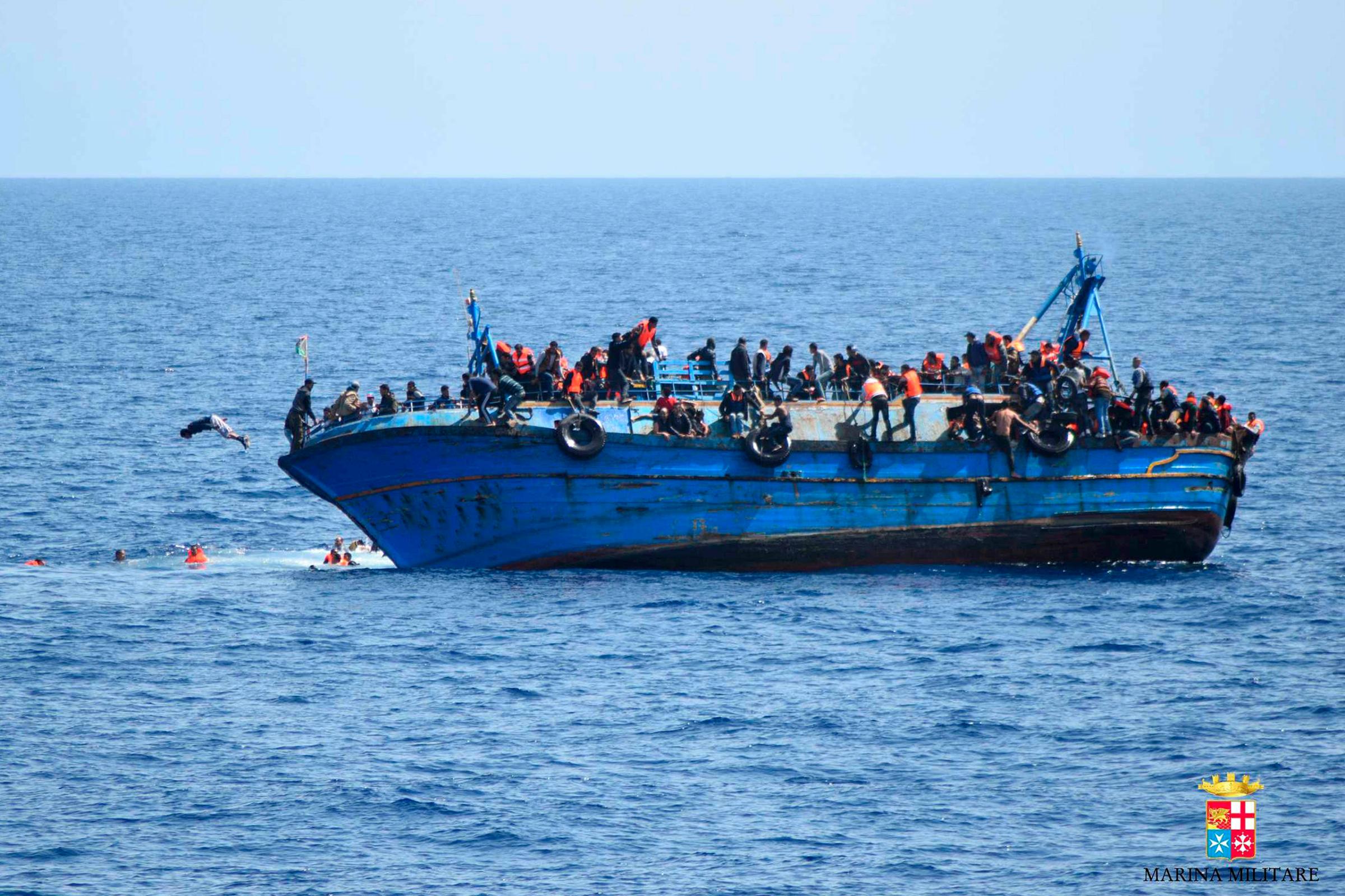 This handout picture released on May 25, 2016 by the Italian Navy (Marina Militare) shows the shipwreck of an overcrowded boat of migrants off the Libyan coast today. At least seven migrants have drowned after the heavily overcrowded boat they were sailing on overturned, the Italian navy said. The navy said 500 people had been pulled to safety and seven bodies recovered, but rescue operations were continuing and the death toll could rise. The navy's Bettica patrol boat spotted "a boat in precarious conditions off the coast of Libya with numerous migrants aboard," it said in a statement. / AFP PHOTO / MARINA MILITARE / STR / RESTRICTED TO EDITORIAL USE - MANDATORY CREDIT "AFP PHOTO / MARINA MILITARE" - NO MARKETING NO ADVERTISING CAMPAIGNS - DISTRIBUTED AS A SERVICE TO CLIENTS STR/AFP/Getty Images