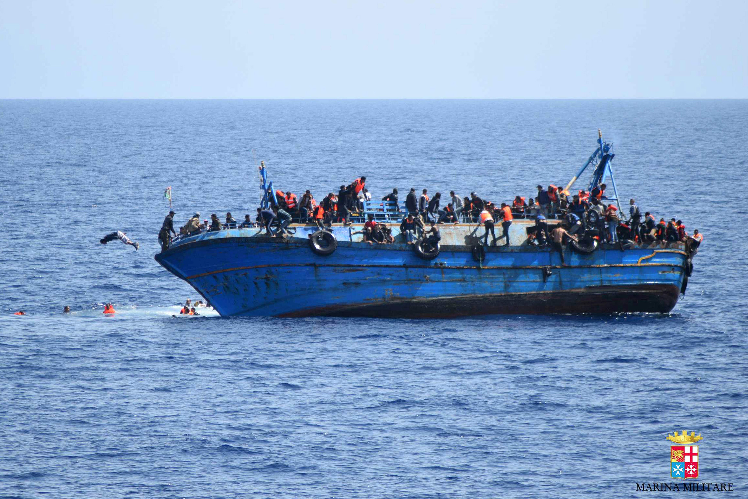 The navy's Bettica patrol boat spotted "a boat in precarious conditions off the coast of Libya with numerous migrants aboard," it said in a statement. (Italian Navy/AFP/Getty Images)