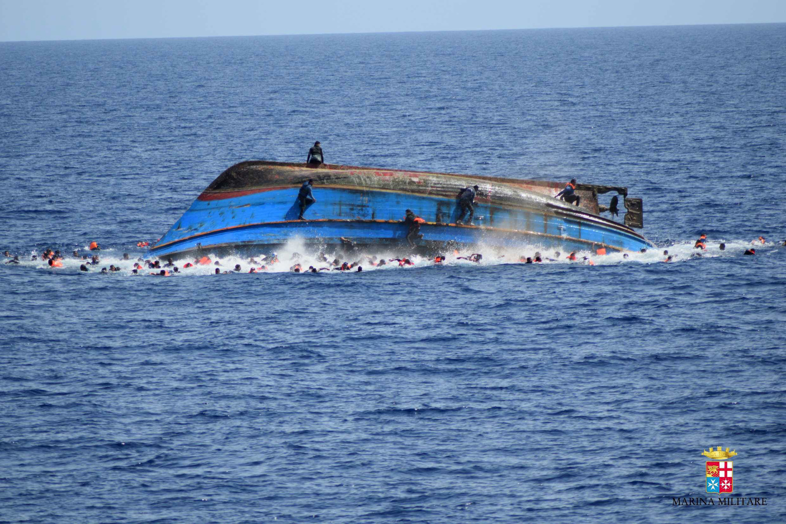 The navy said 500 people had been pulled to safety and seven bodies recovered, but rescue operations were continuing and the death toll could rise. (Italian Navy/AFP/Getty Images)