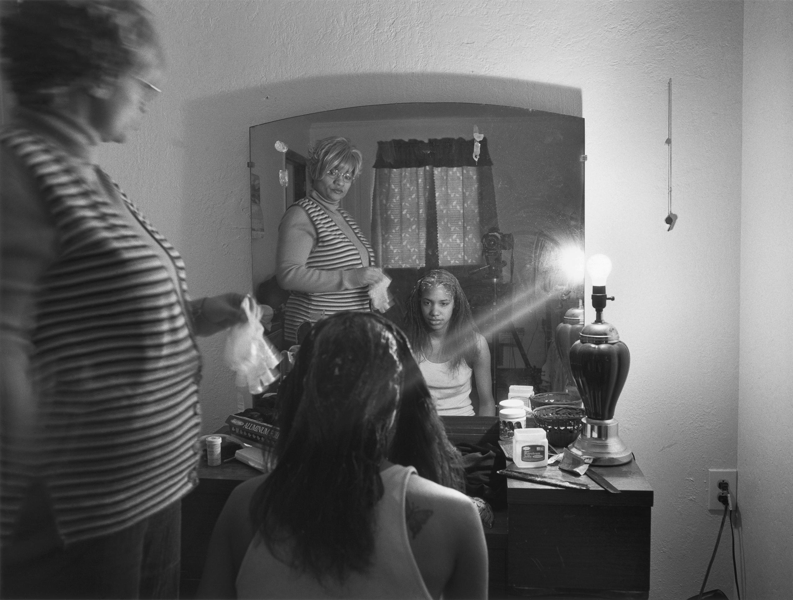 Mom Relaxing My Hair, 2005 from the series The Notion of Family (LaToya Ruby Frazier)