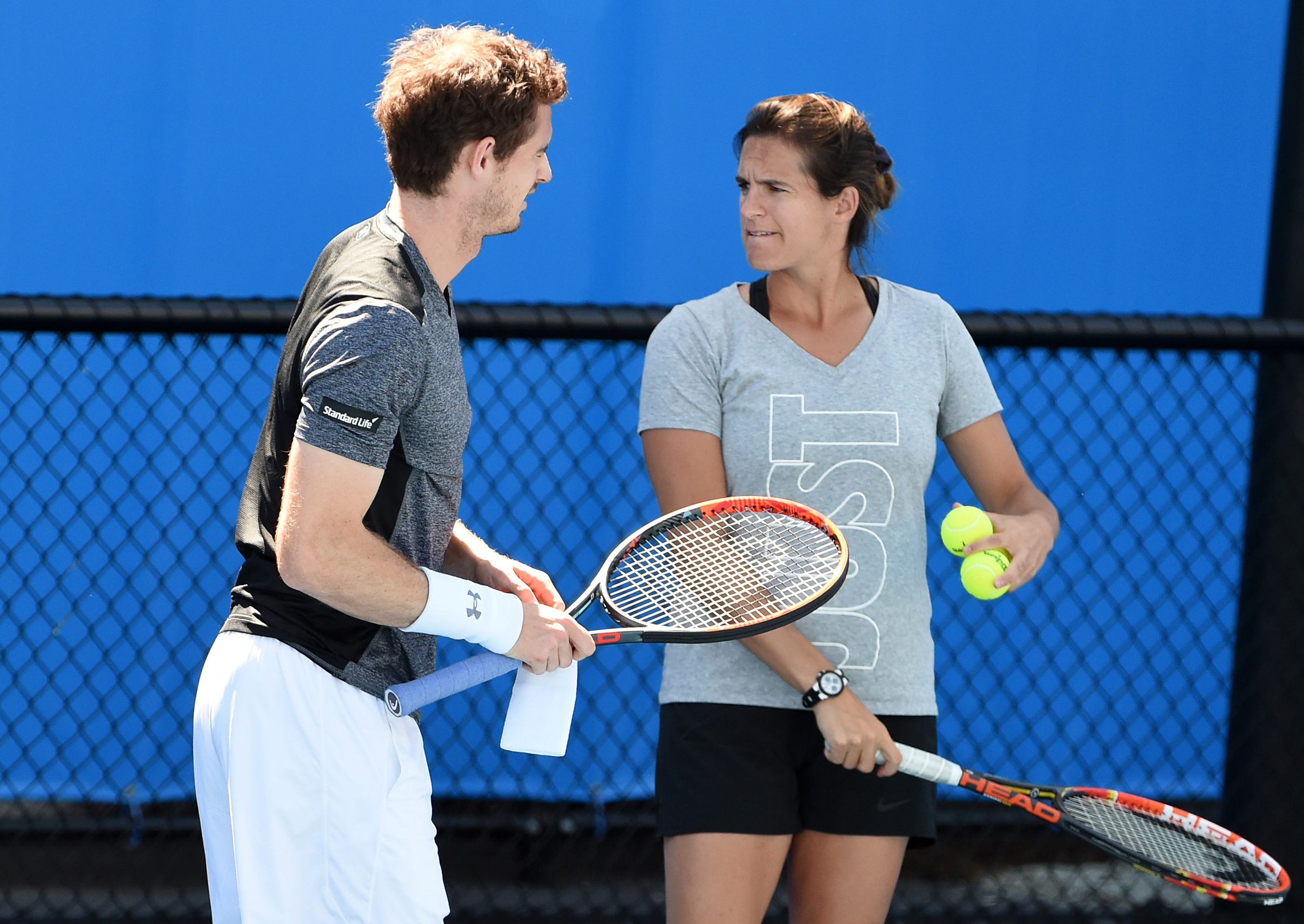 Britain's Andy Murray (L) walks with his coach Amelie Mauresmo during a training session on day seven of the 2016 Australian Open tennis tournament in Melbourne on January 24, 2016. (William West—AFP/Getty Images)