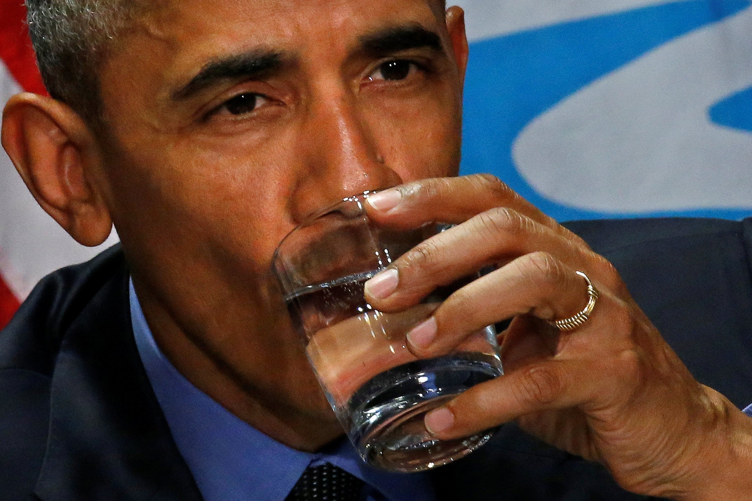U.S. President Barack Obama drinks a glass of filtered water from Flint, a city struggling with the effects of lead-poisoned drinking water, during a meeting will local and federal authorities in Michigan