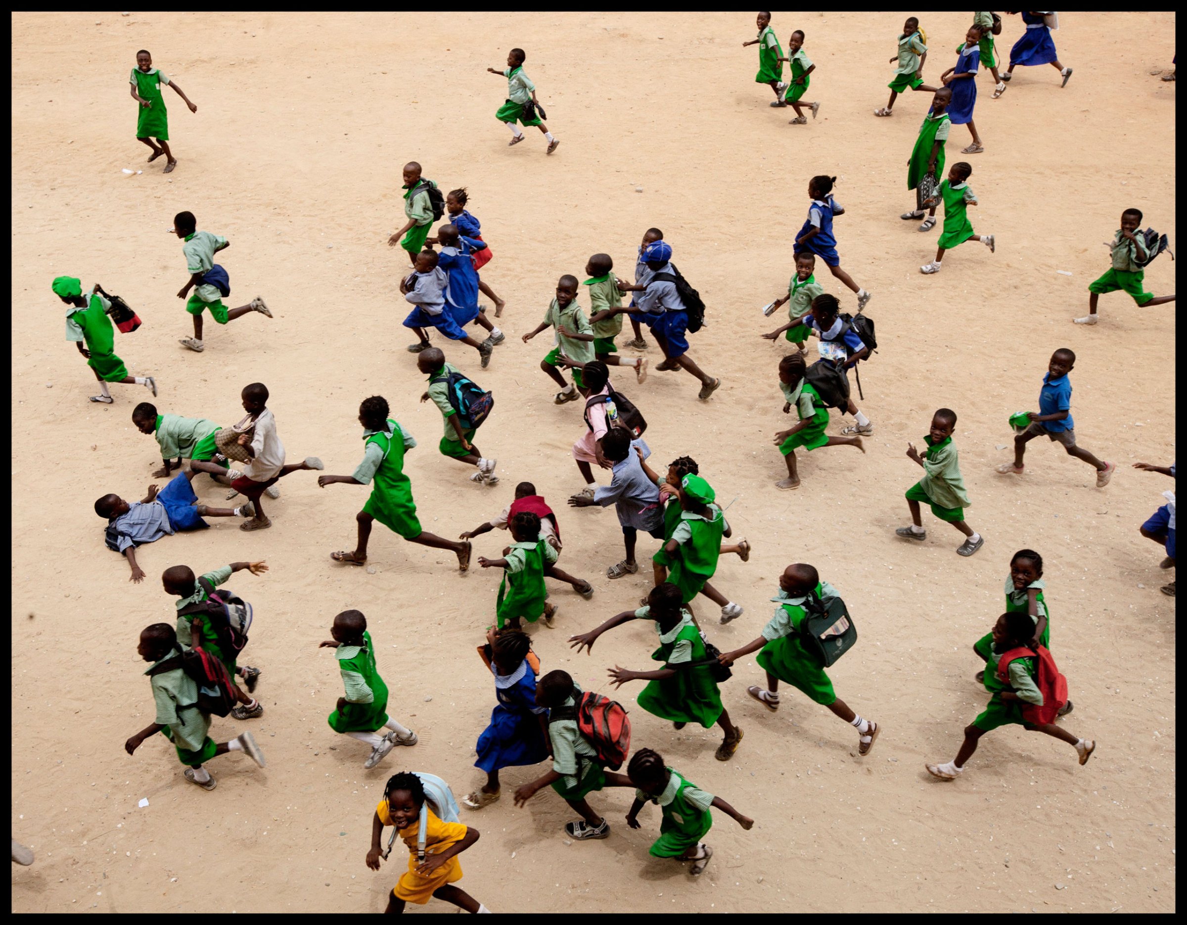 Children run at a school in Lagos. More African kids are finishing primary school, but that’s just the beginning