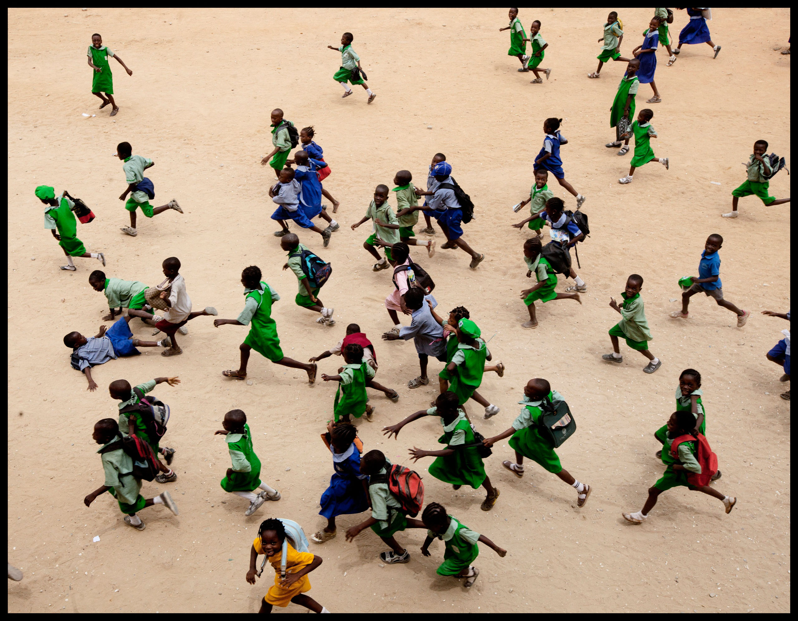Children run at a school in Lagos. More African kids are finishing primary school, but that’s just the beginning (Benedicte Kurzen—New York Times/Redux)
