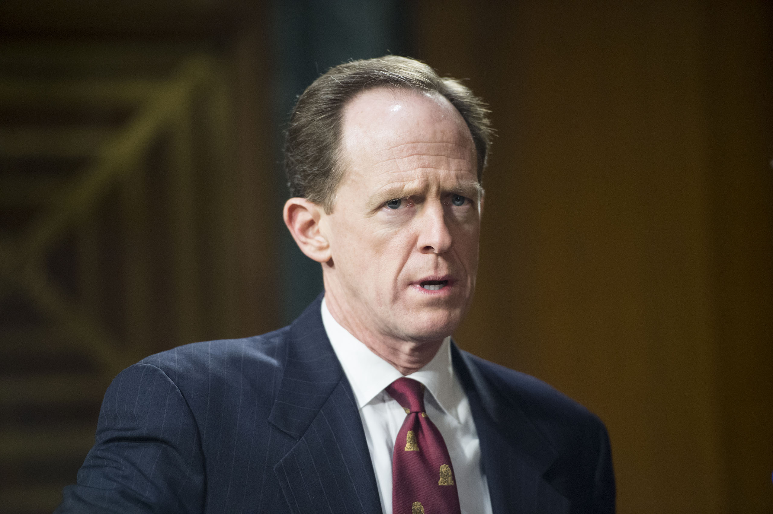 Pat Toomey arrives for the Senate Banking, Housing and Urban Affairs Committee hearing on 
