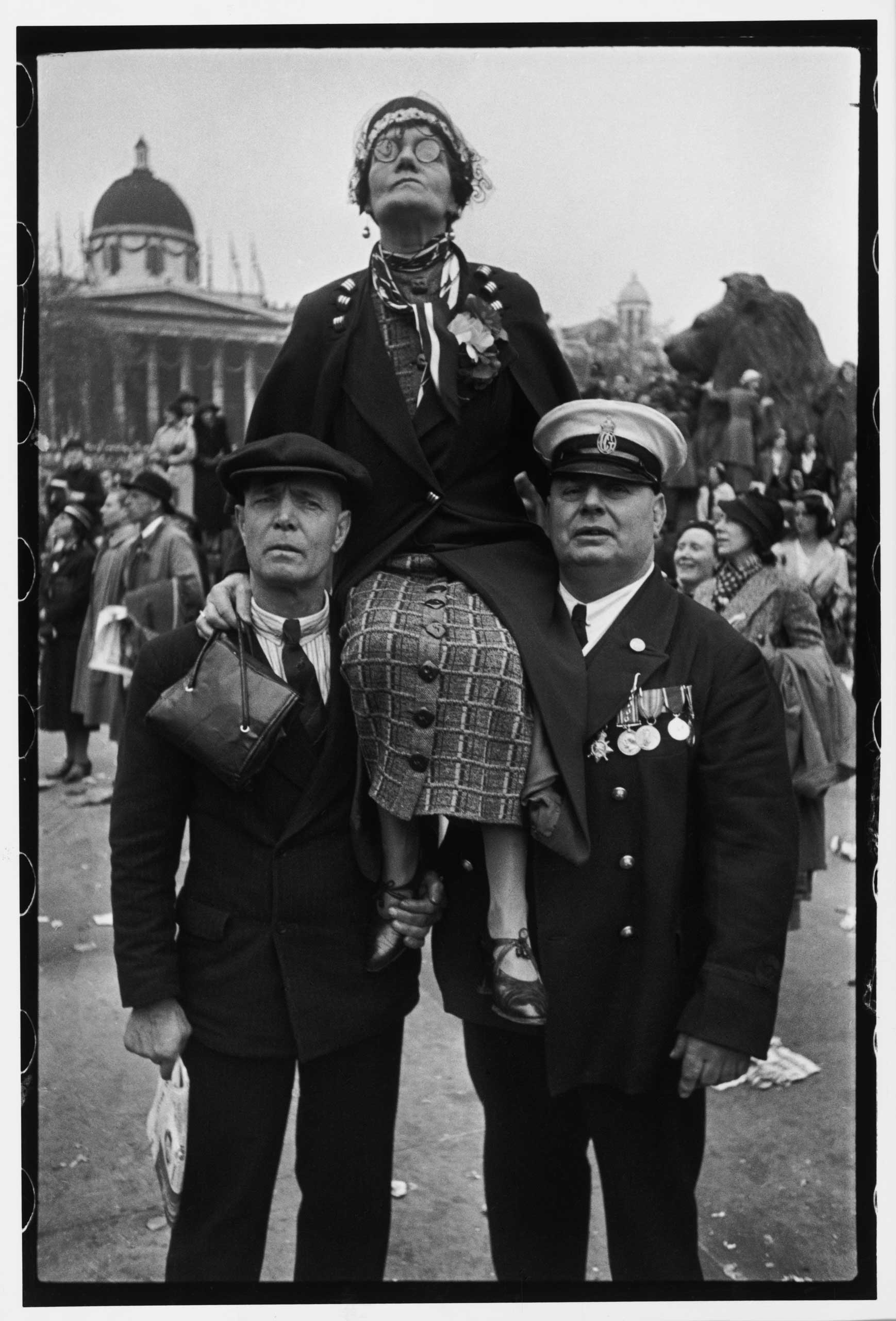 Waiting in Trafalgar Square for the coronation parade of King George VI. London, May 12, 1937.
