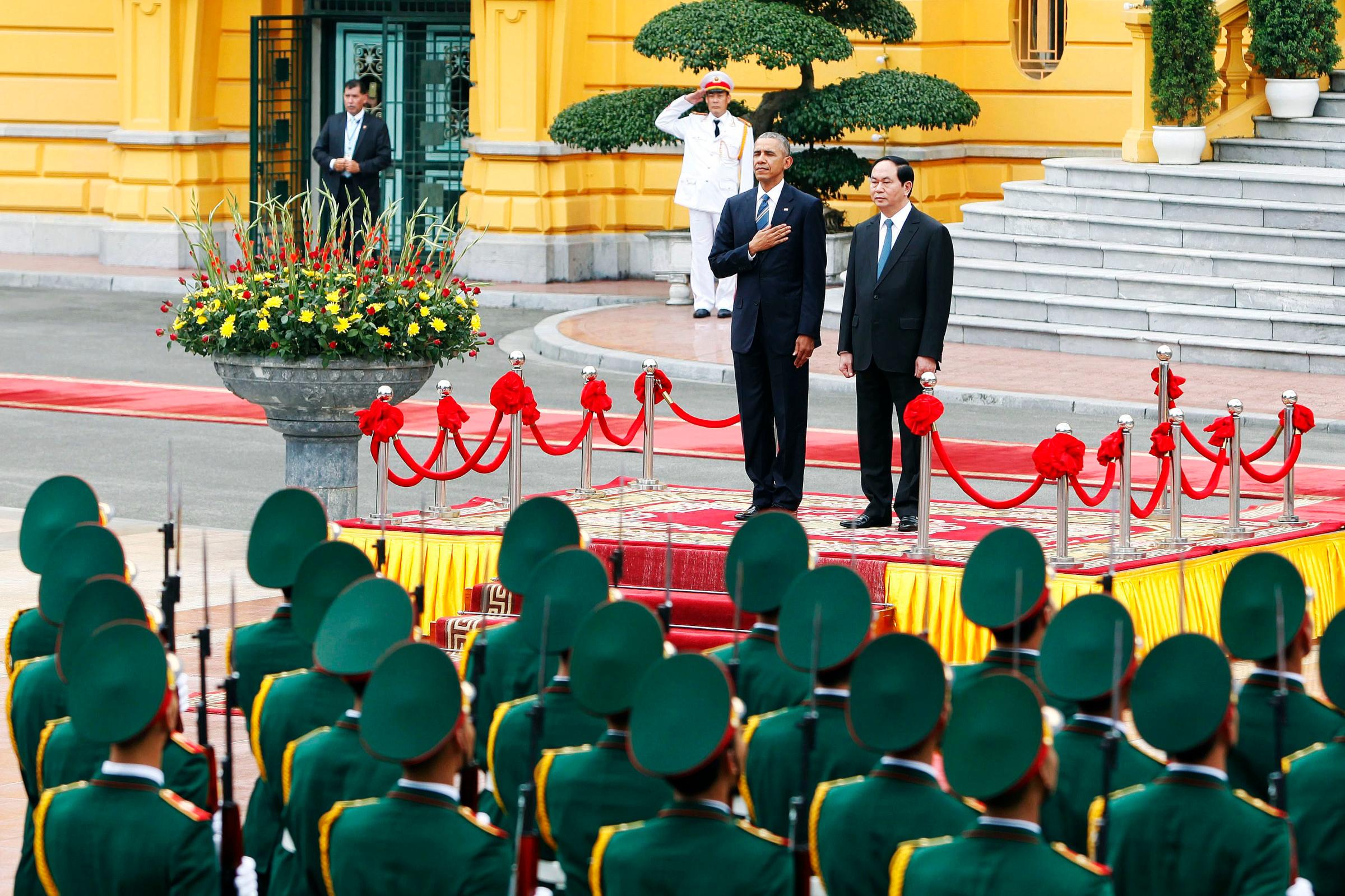 U.S. President Barack Obama and Vietnam's President Tran Dai Quang review an honor guard at the Presidential Palace in Hanoi, Vietnam on May 23, 2016.