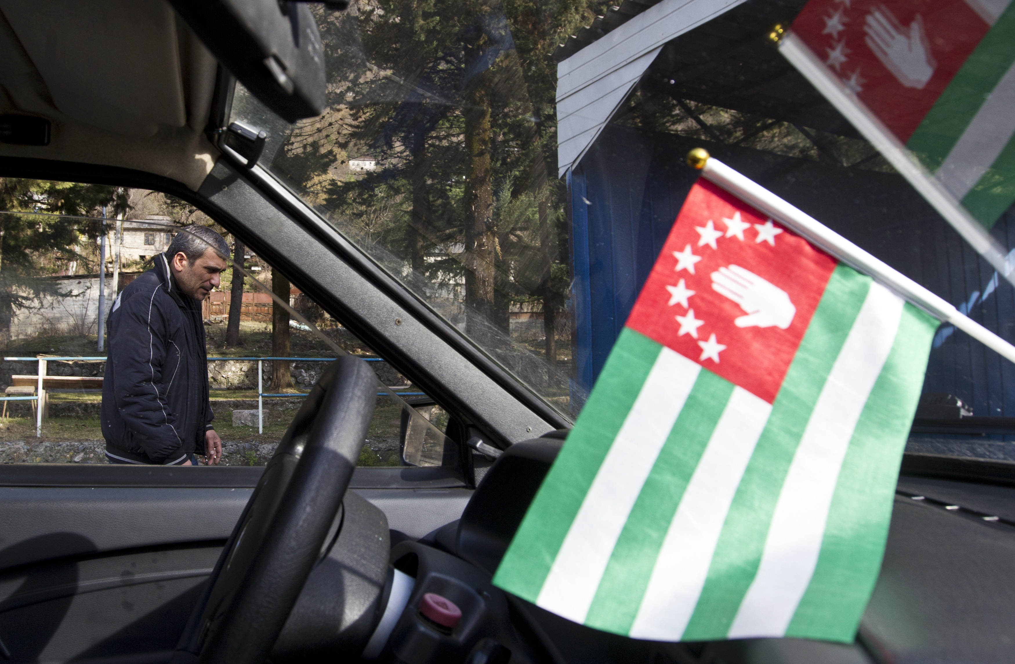 A flag of Abkhazia is on display inside a car in the town of Tkvarcheli, southeast of Sukhumi, the capital of Georgia's breakaway region of Abkhazia Dec. 27, 2013. (Maxim Shemetov—Reuters)