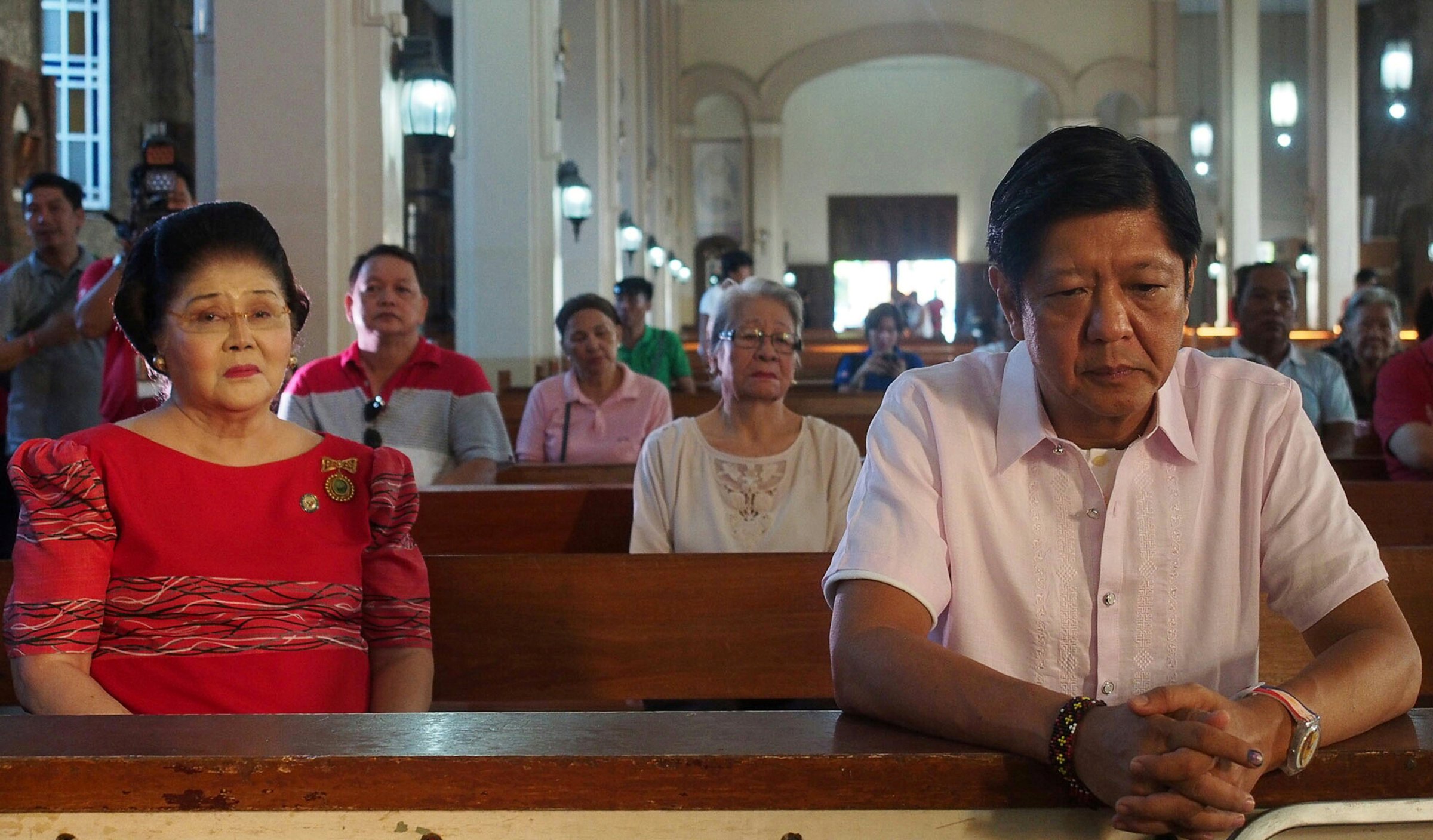 Philippine vice-presidential candidate and senator Ferdinand "BongBong" Marcos, son and namesake of late dictator former President Ferdinand Marcos, attends a mass with his mother in Batac, Ilocos Norte province, north of Manila