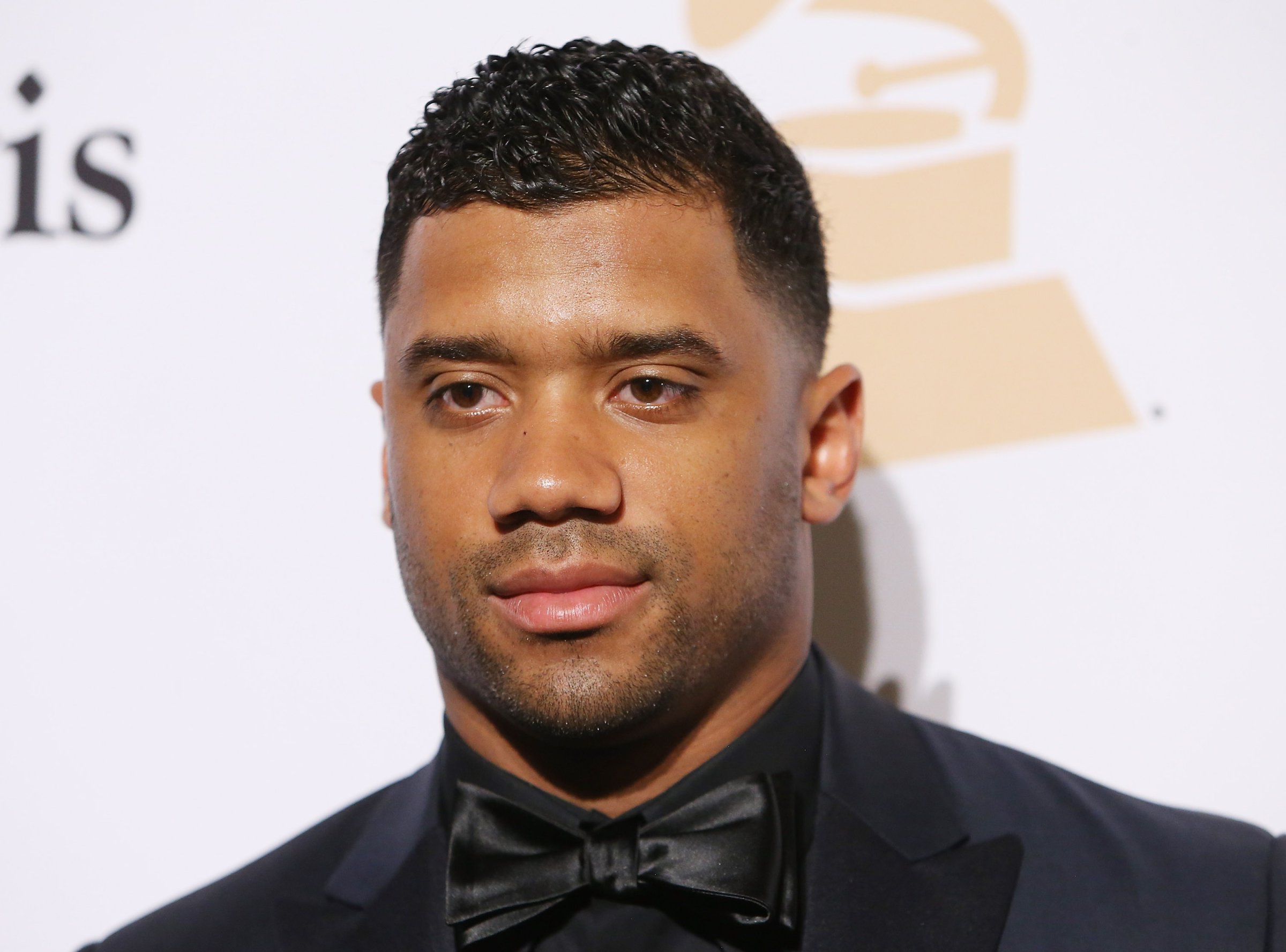 Russell Wilson arrives at the 2016 Pre-GRAMMY Gala and Salute to Industry Icons honoring Irving Azoff held at The Beverly Hilton Hotel in Beverly Hills, Calif. on Feb. 14, 2016.