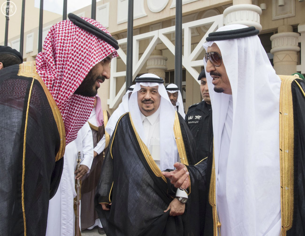 Saudi King Salman, right, speaks with his son and Deputy Crown Prince Mohammed bin Salman, left, before the king's trip to Jeddah, in Riyadh, May 9, 2016.