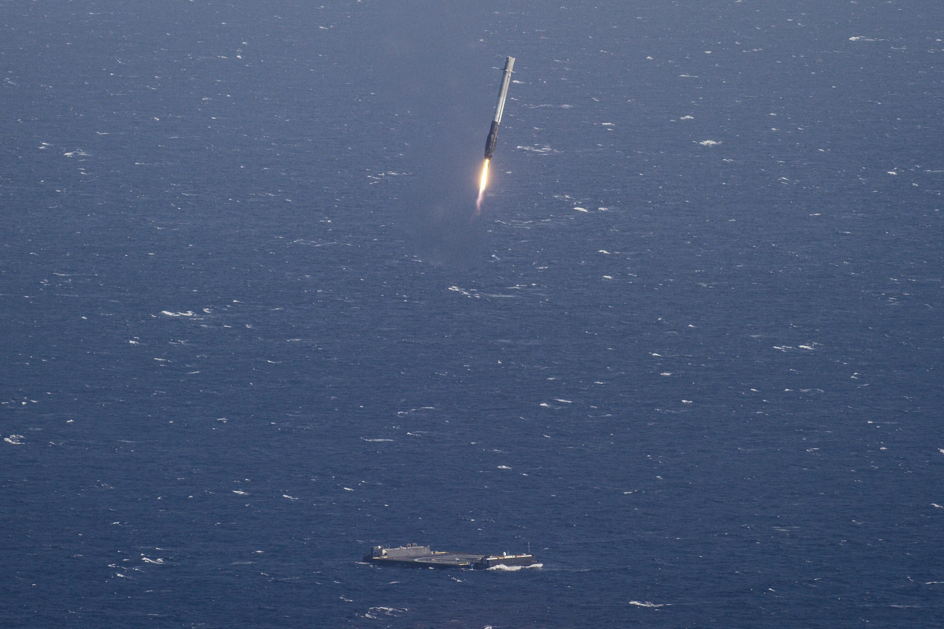 A SpaceX Falcon 9 rocket landing on a platform at sea in the Atlantic Ocean, on April 9, 2016. (SPACEX/EPA)