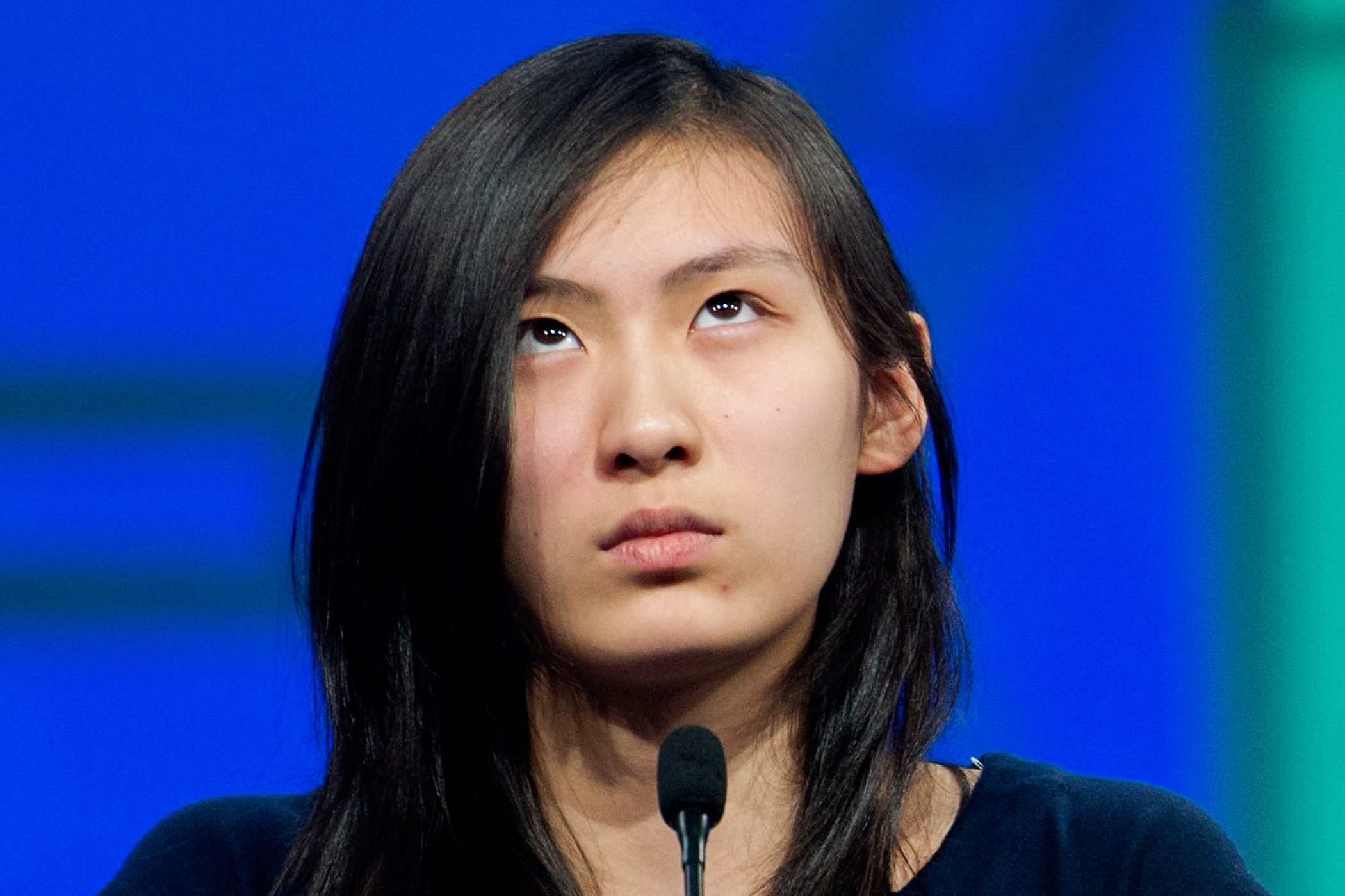 Emily Sun, 13, of Boston, Mass., spells her word during a preliminary round of the Scripps National Spelling Bee in National Harbor, Md.,  May 25, 2016.