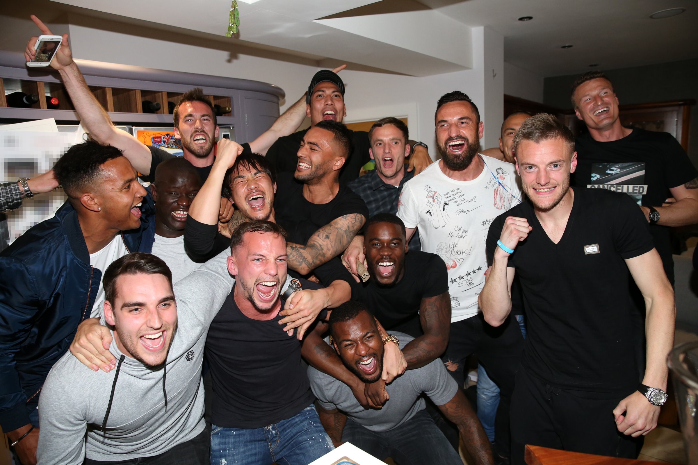 Settle down boys: Players on the champion Leicester City Football Club watch rivals on TV during their championship run.