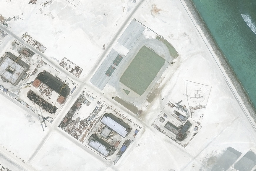 A satellite image of Subi Reef, captured by DigitalGlobe on May 1, 2016, shows the beginnings of a running track and basketball courts.