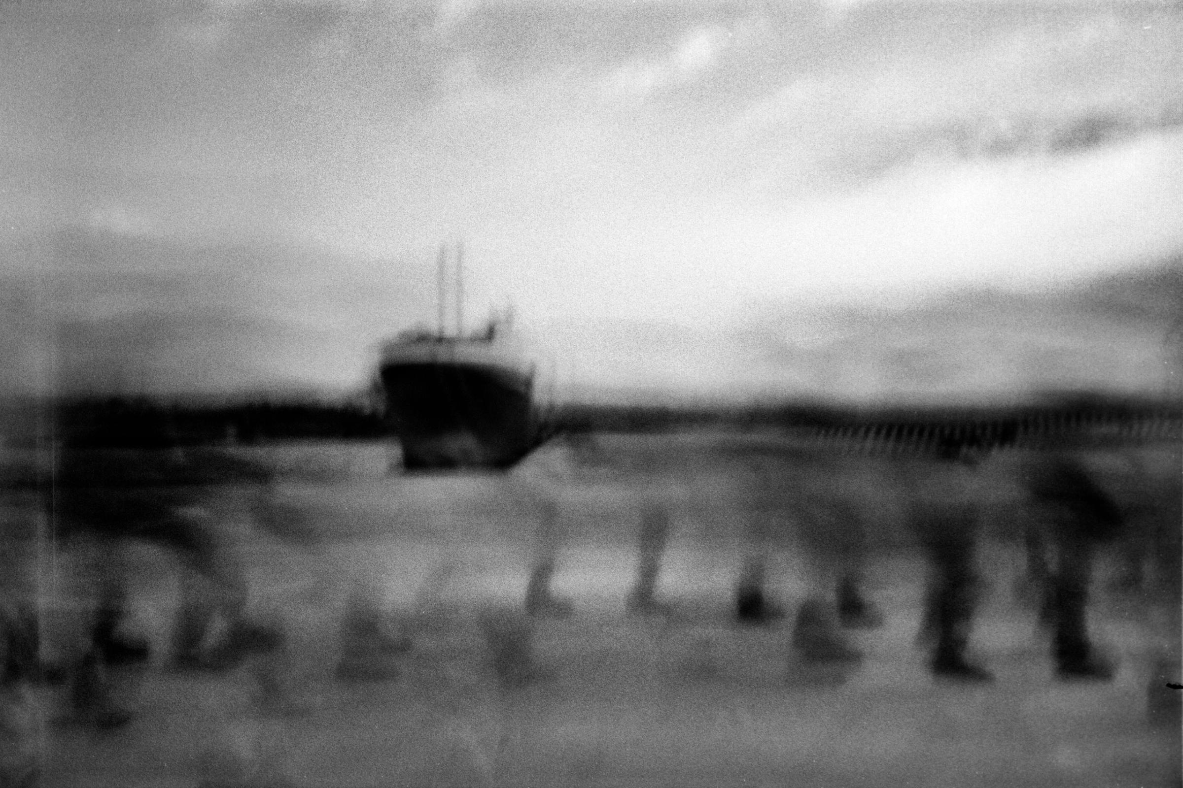 Refugees at the port in Augusta, Italy after arriving, June 20, 2015. This photo was taken with the pinhole camera 'Pinolina' .