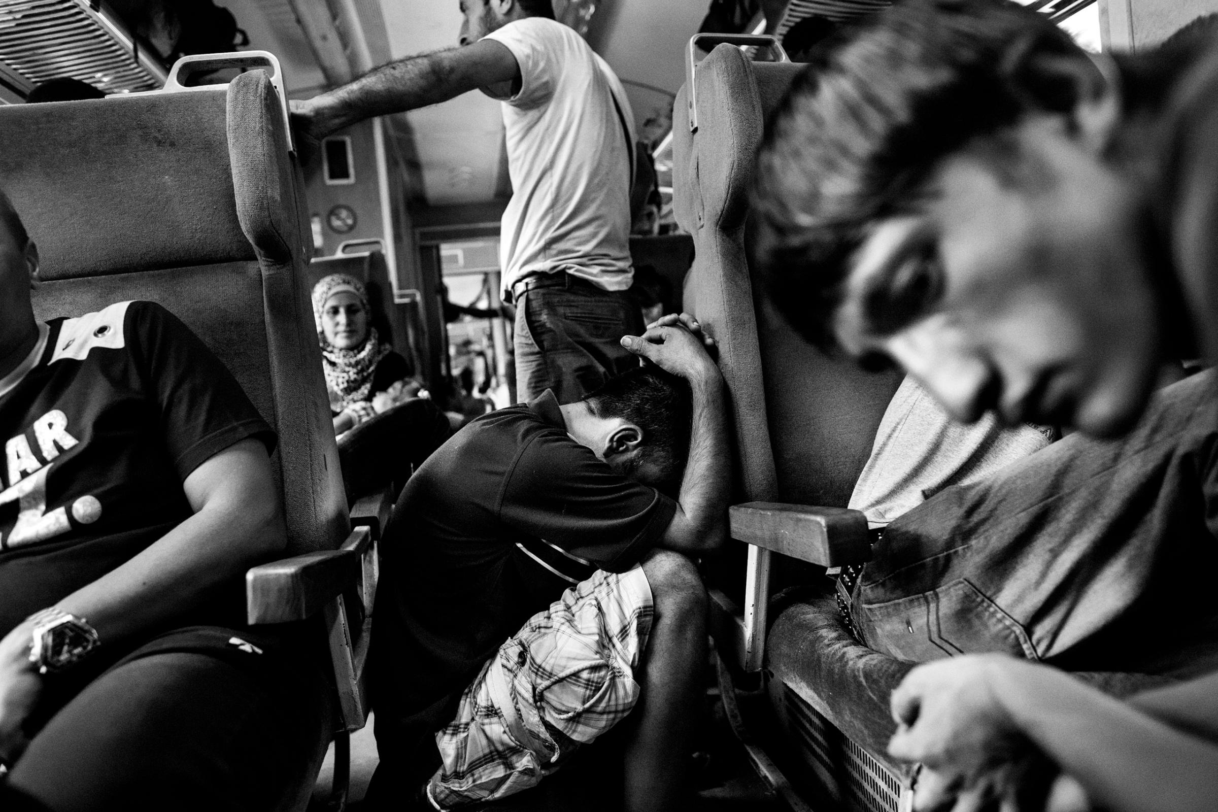 Refugees, largely from Syria and Afghanistan, travel by train through Macedonia Aug. 27, 2015.