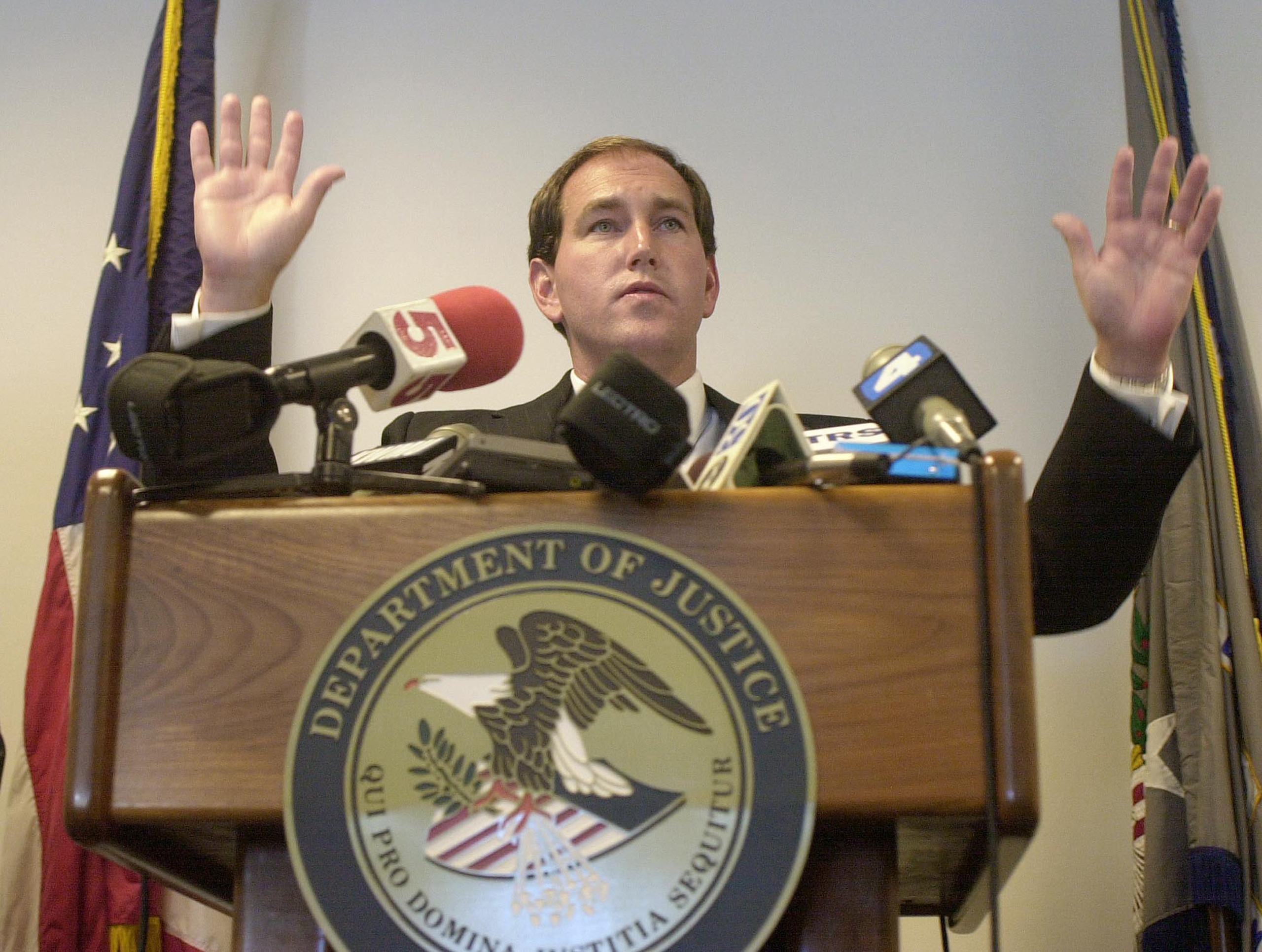 Raymond W. Gruender, United States Attorney, Eastern District of Missouri, gestures Wednesday, Oct. 3, 2001 while responding to questions concerning the U.S. Department of Justice report in the June 12, 2000, deaths of drug suspect Earl Murray and Ronald Beasley. The two unarmed men were shot and killed in the parking lot of the Jack in the Box restaurant in north St. Louis as they tried to escape in Murray's car during an encounter with a St. Louis County Multi-Jurisdictional Task Force. The report concluded that evidence does not show the unidentified officers willfully used more force than was reasonable. (AP Photo/James A. Finley)