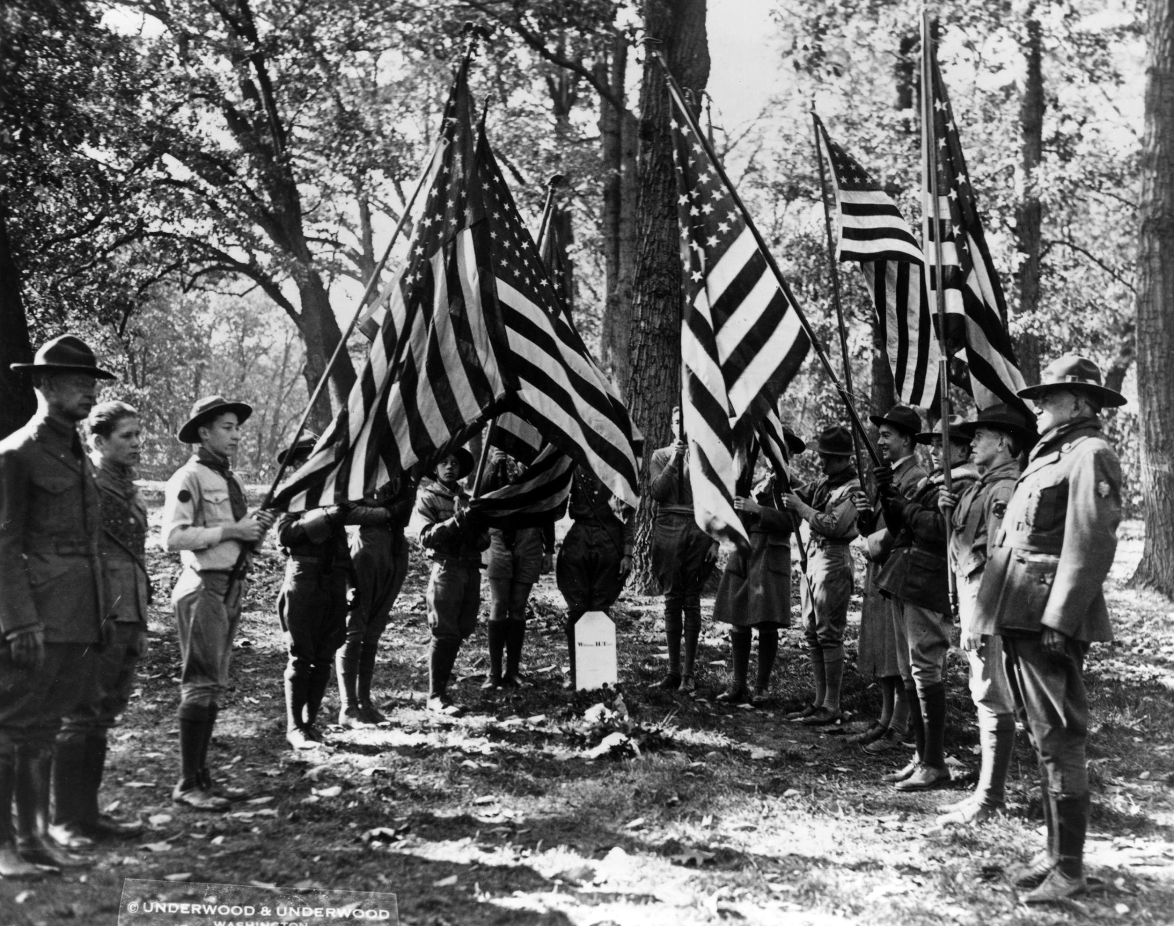 A delegation of boy scouts at the grave of former President William Howard Taft in Arlington National Cemetery, Washington DC, six months after his death. 1930.