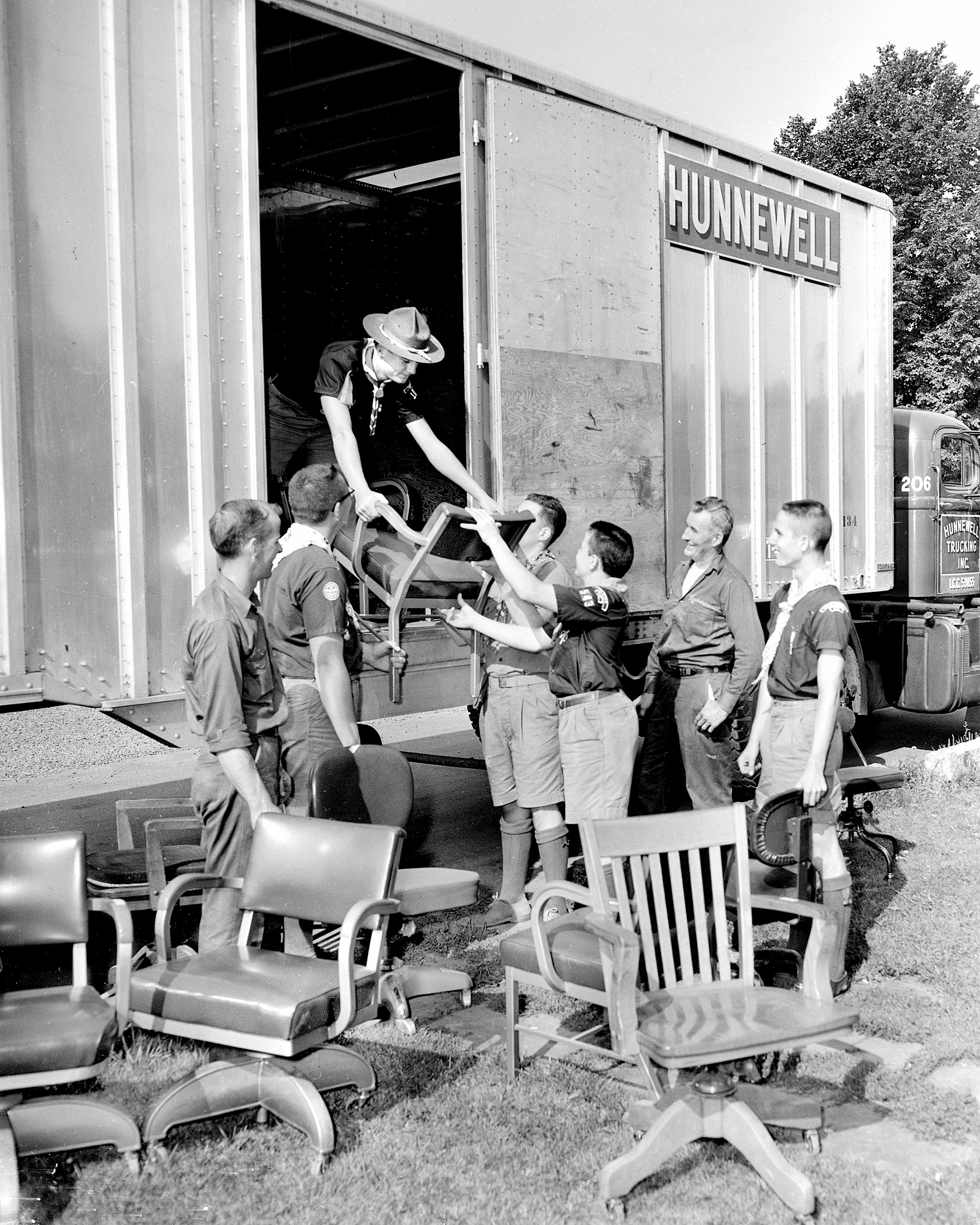 The Pine Tree Council, Boy Scouts of America, moved from Baxter Boulevard to new quarters on Auburn Street with Hunnewell Trucking helping out. Materials were loaded and unloaded by scouts and Hunnewell drivers. 1959.