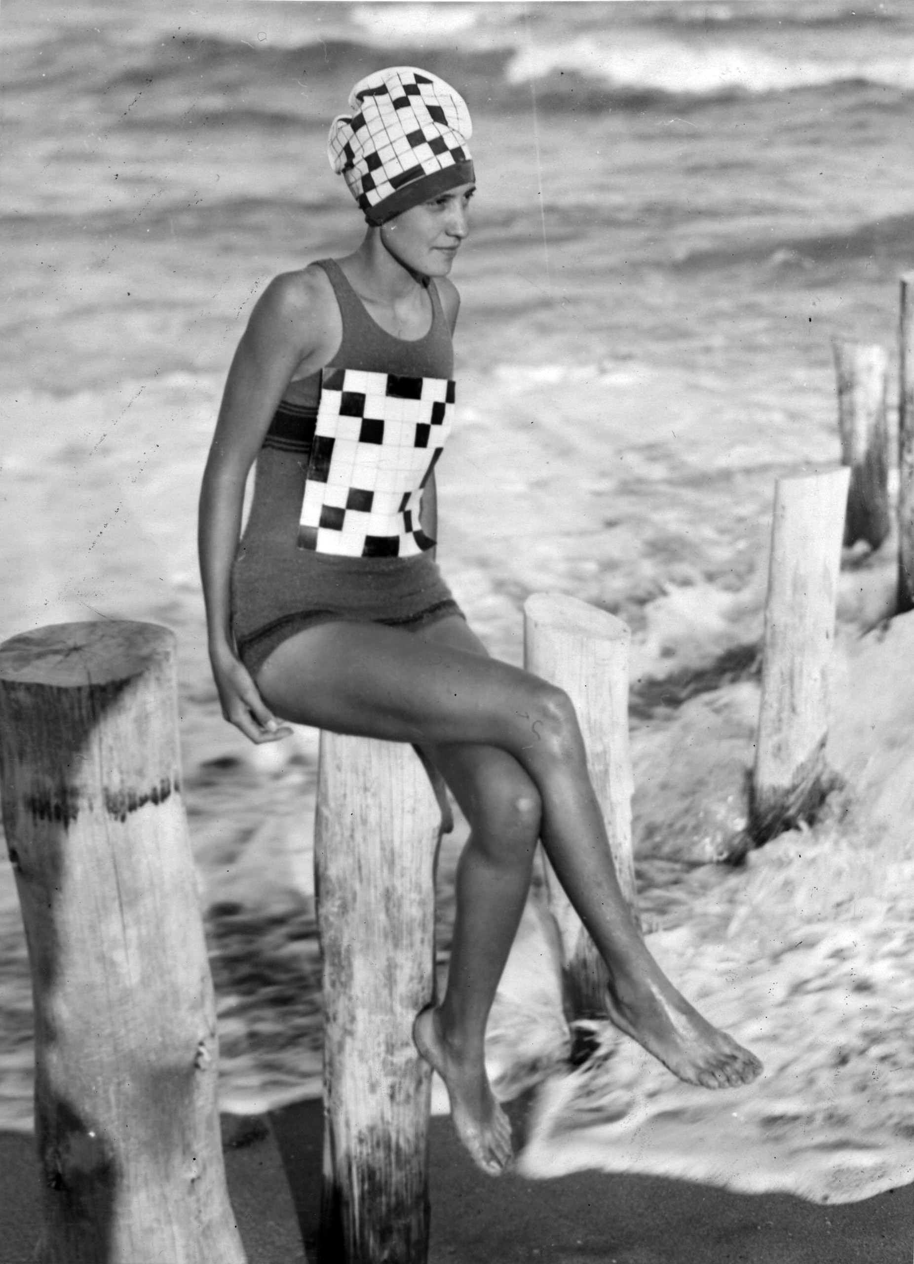 Verna Lee Fisher sporting her newly created crossword swimsuit with matching bathing hat, at Palm Beach, Florida, circa 1933.