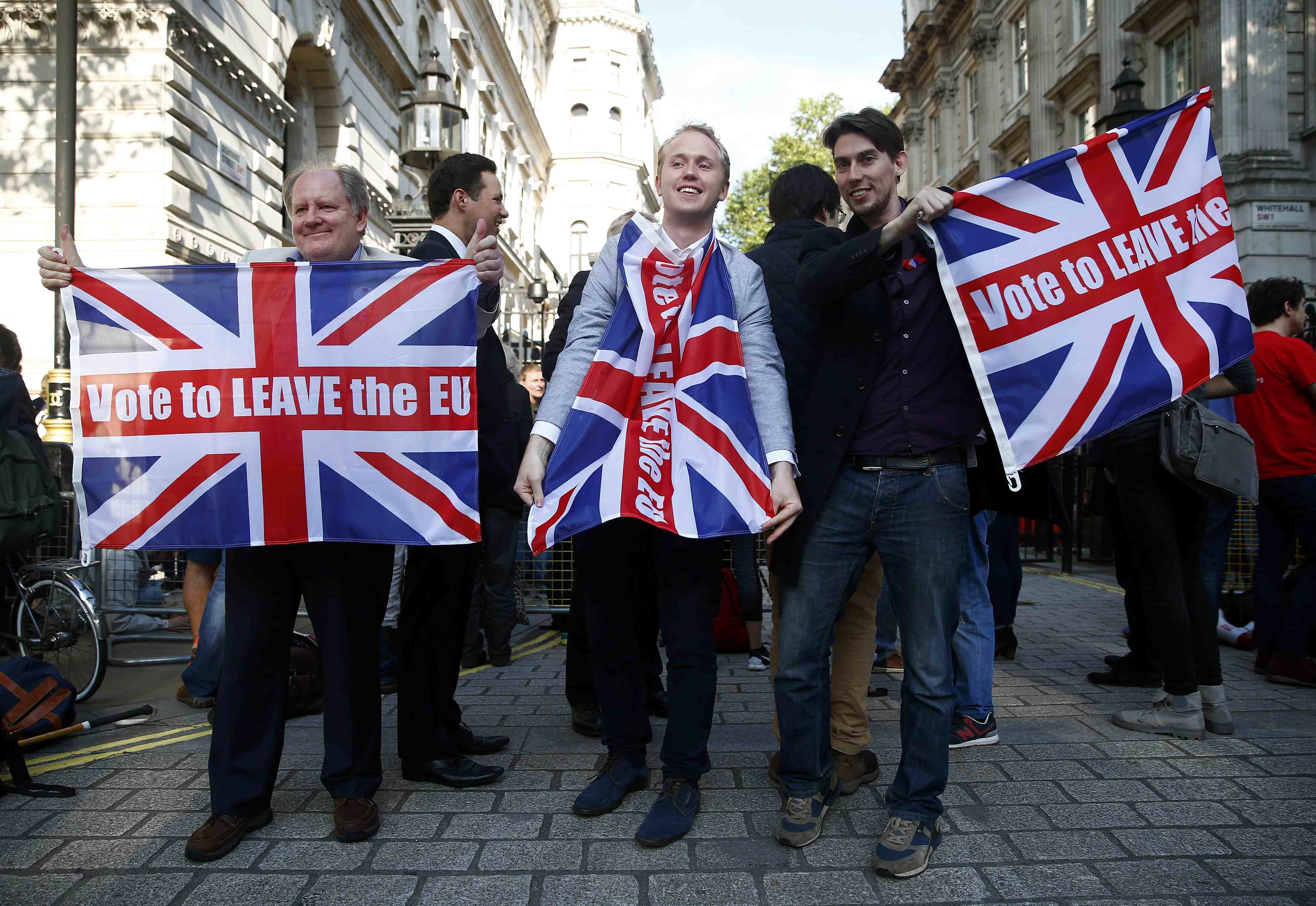 Vote leave supporters wave Union flags, following the result of the EU referendum, outside Downing Street in London on June 24, 2016. (Neil Hall—Reuters)