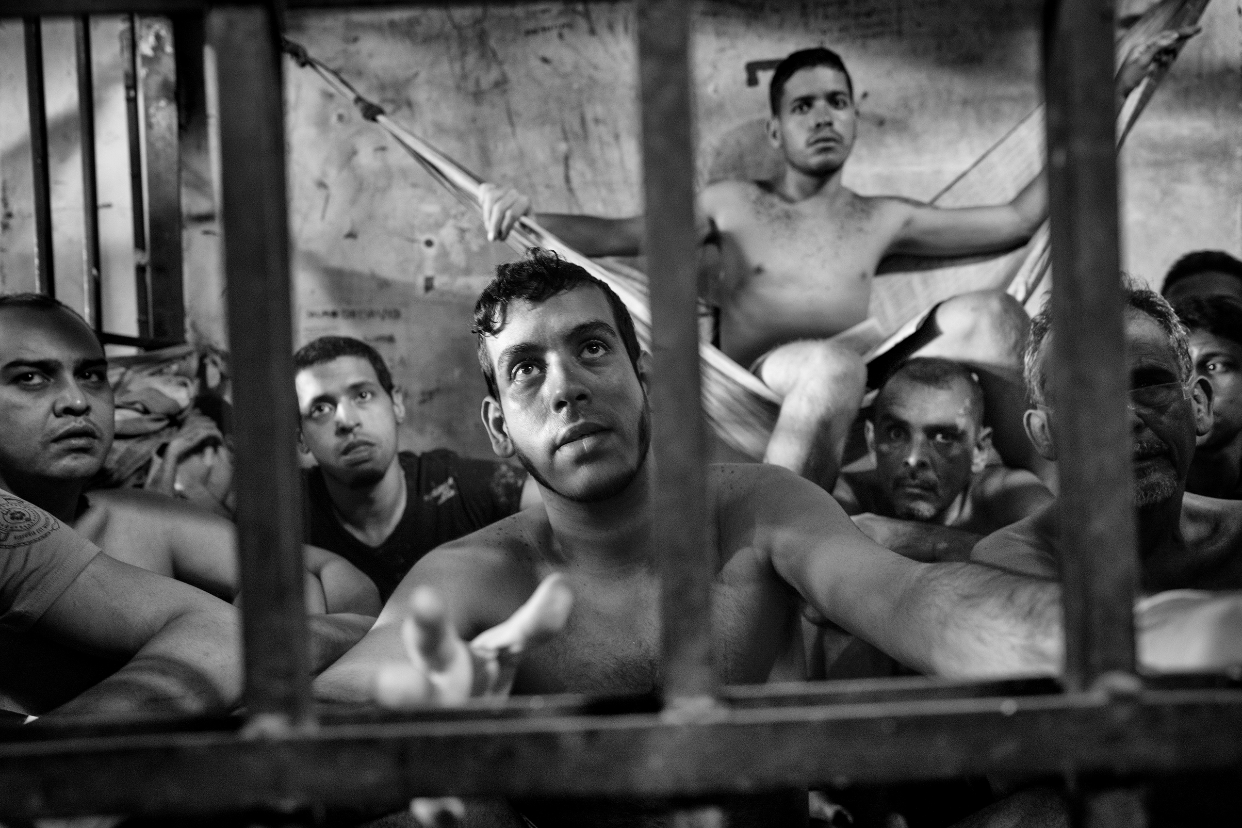A group of prisoners sit in their cells inside the municipal police station of Chacao, located east of Caracas, Venezuela, May 27, 2016. (Alvaro Ybarra Zavala—Getty Images Reportage for TIME)
