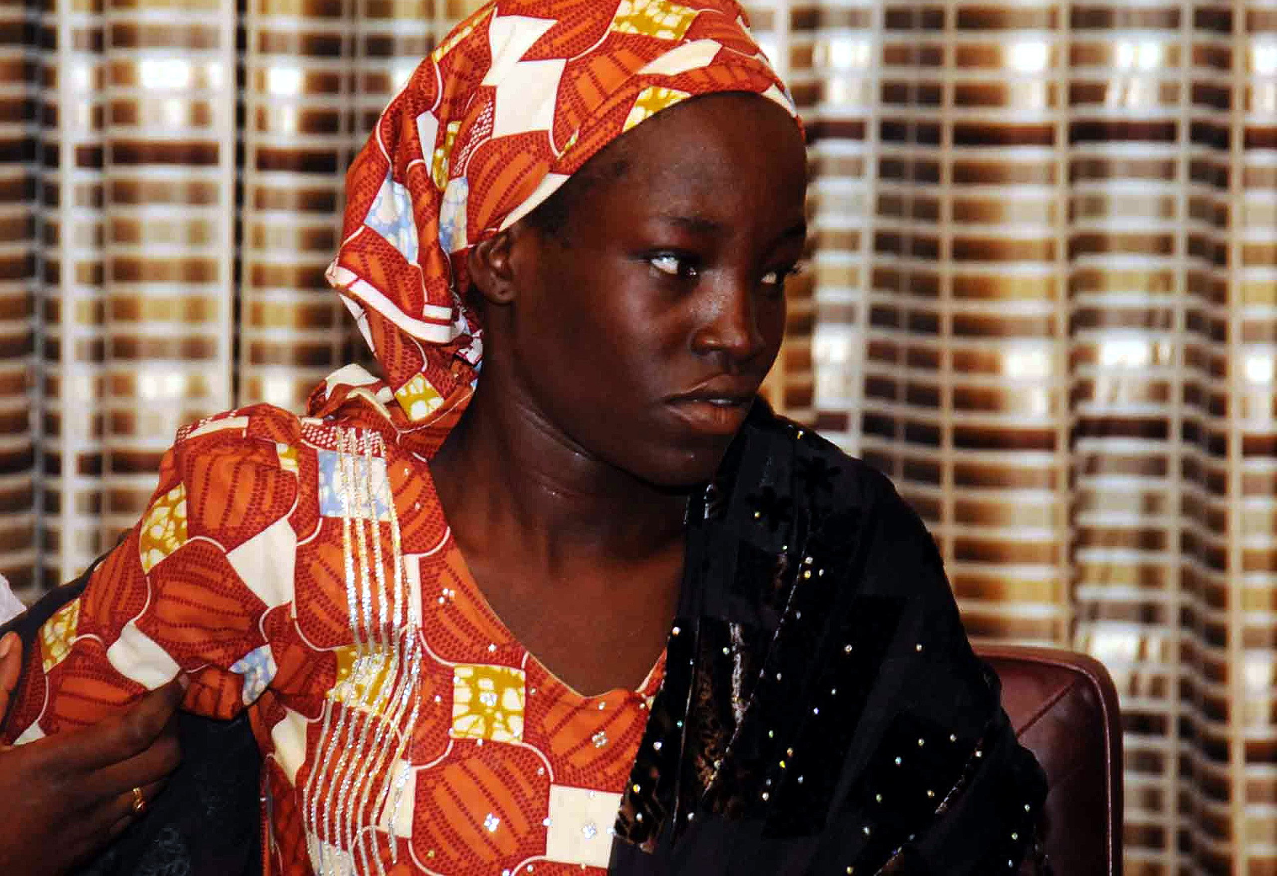 Amina Ali Nkeki, who was one of the Nigerian school girls that are kidnapped by Boko Haram, visits President of Nigeria Muhammadu Buhari at the Presidency Residence in Abuja, Nigeria on May 19, 2016. (Henry Chukwuedo—Anadolu Agency/Getty Images)