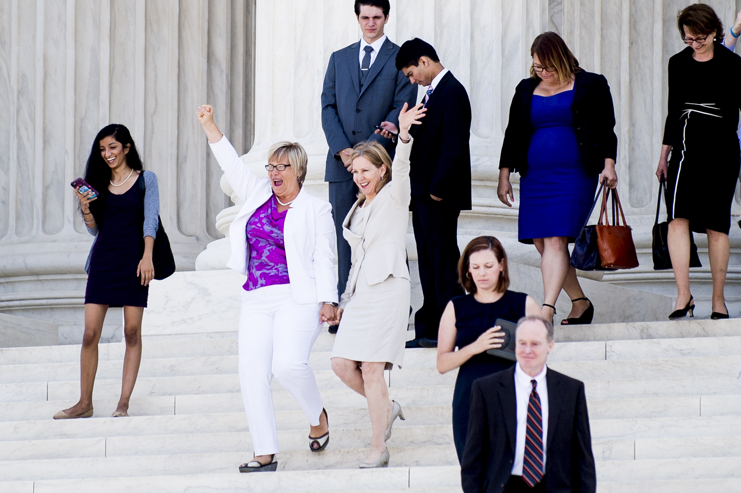 Texas abortion provider Amy Hagstrom-Miller and Nancy Northup, President of The Center for Reproductive Rights wave to supporters as they descend the steps of the United States Supreme Court in Washington, D.C., on June 27, 2016.