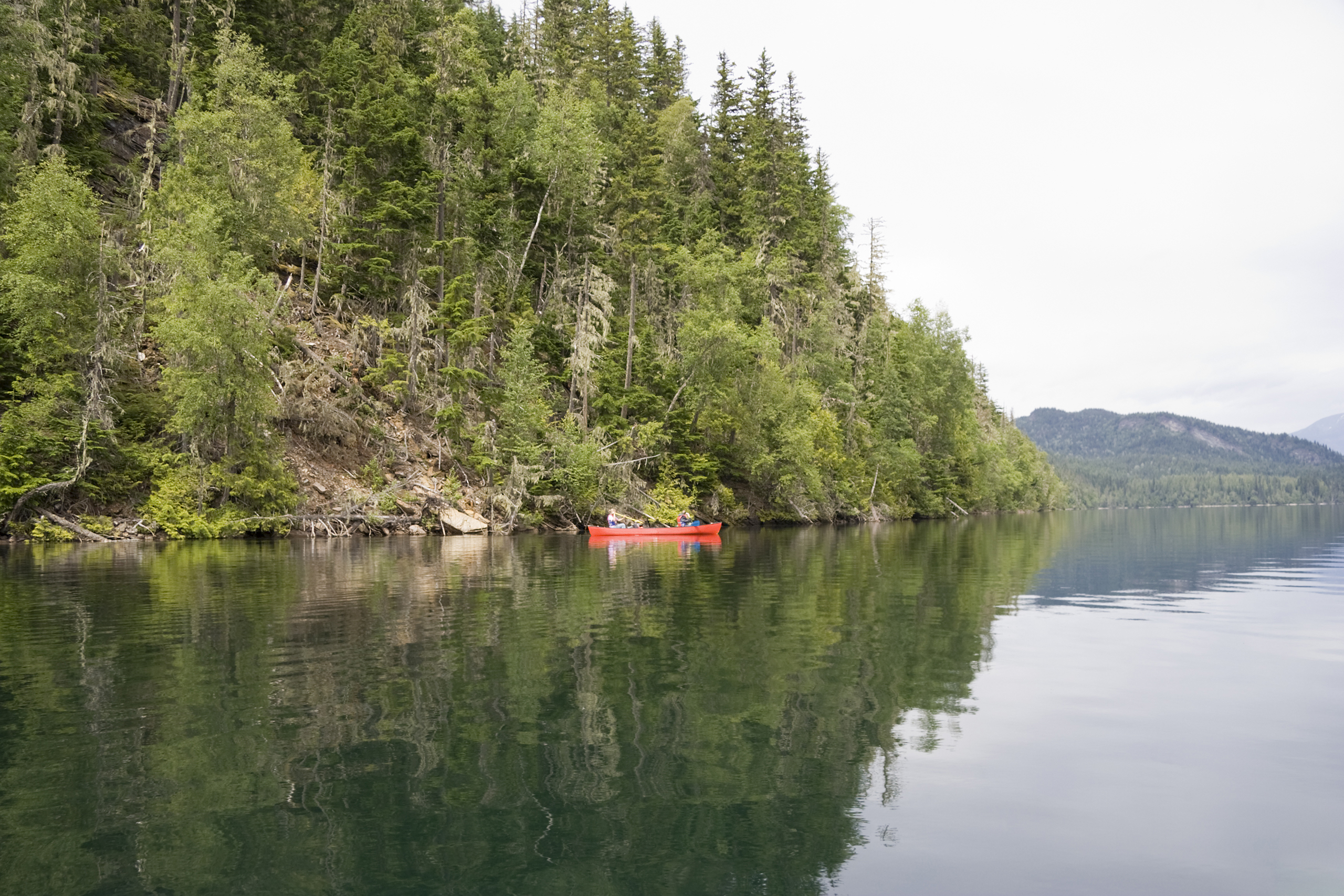 Clearwater lake with canoe