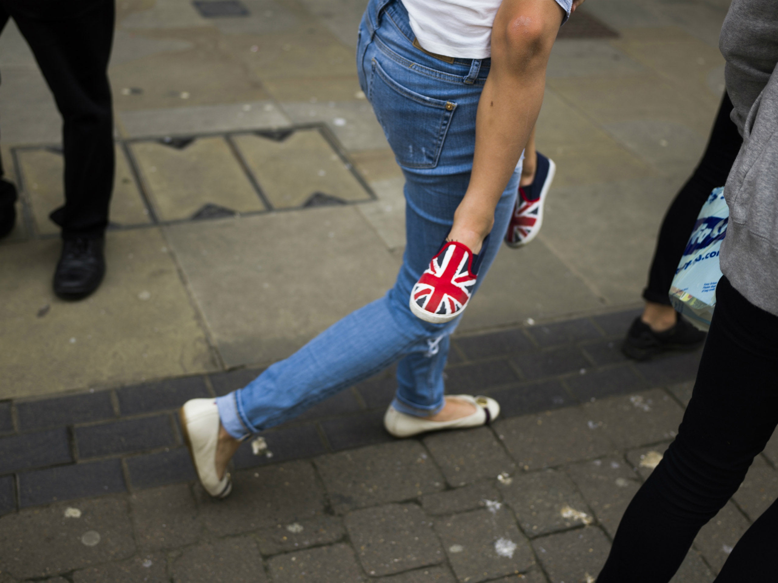 Young boy wearing shoes with a British flag design, Boston, Lincolnshire, June 25, 2016.