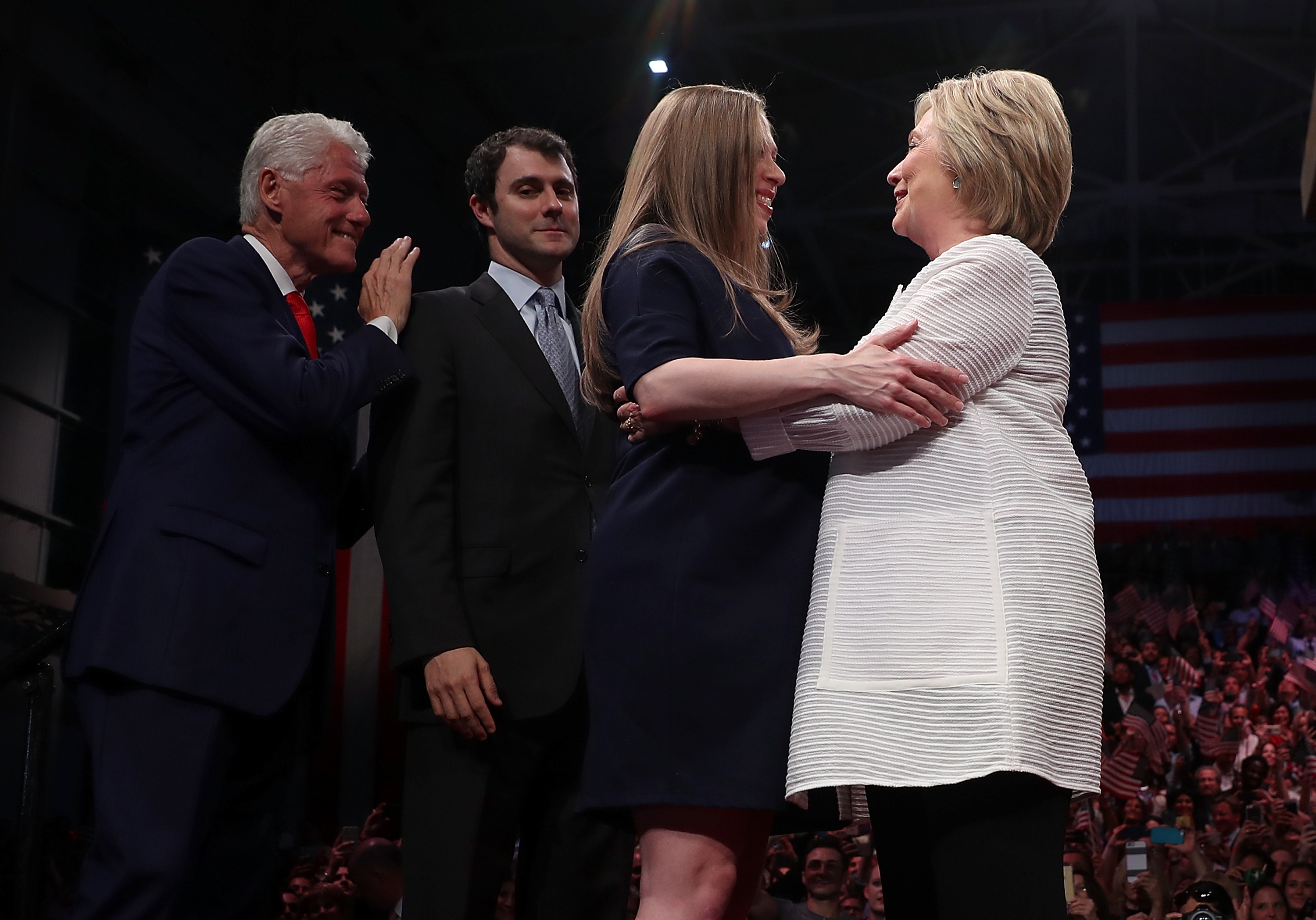 Former U.S. President Bill Clinton, Marc Mezvinsky and Chelsea Clinton greet Democratic presidential candidate former Secretary of State Hillary Clinton during a primary night event on June 7, 2016 in Brooklyn, New York. (Justin Sullivan/Getty Images)
