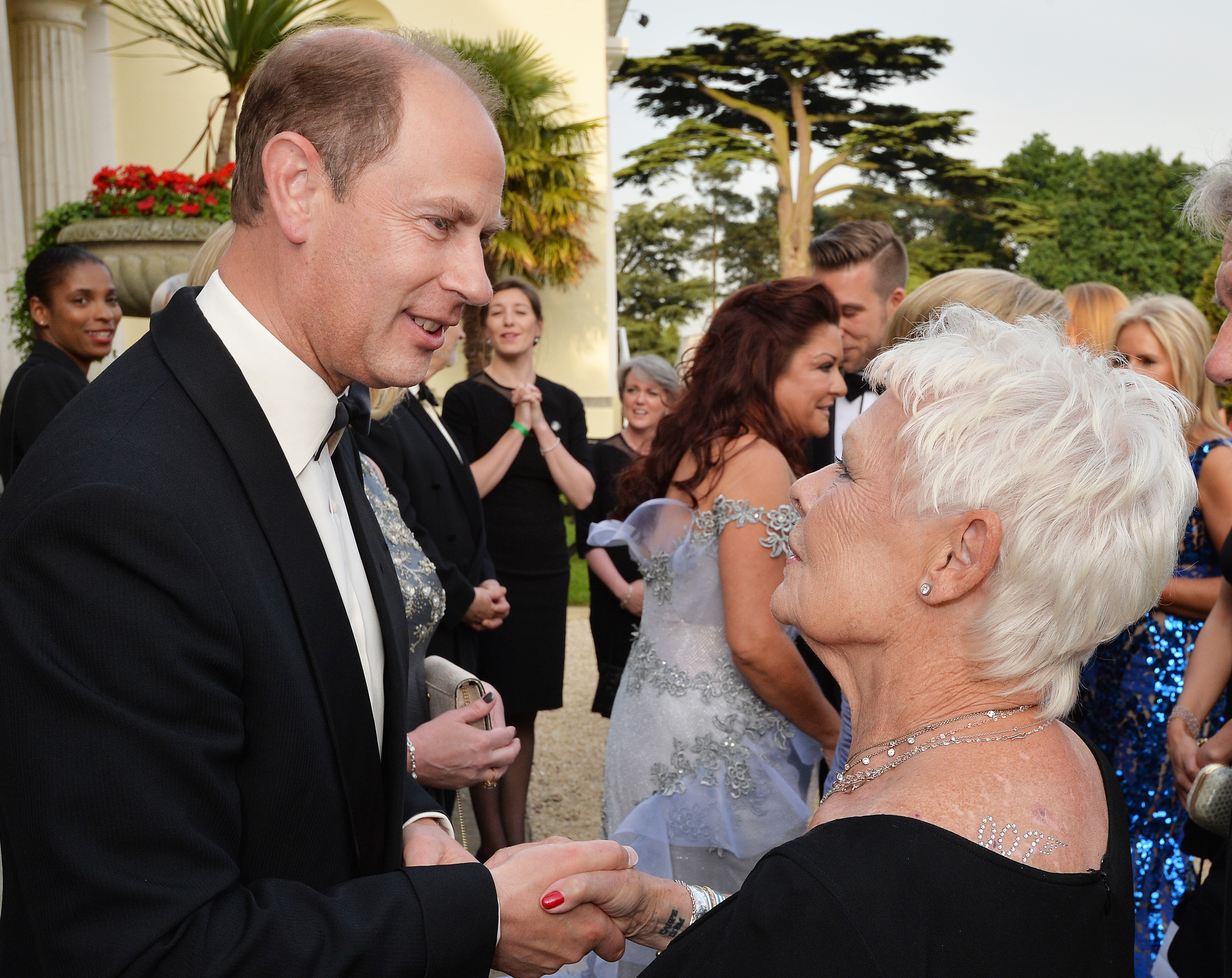 BUCKINGHAMSHIRE, ENGLAND - JUNE 9:   The Earl of Wessex (left) talks with Dame Judi Dench attend a Gala Evening marking the 60th anniversary of The Duke of Edinburgh's Award at Stoke Park on June 9, 2016 in Buckinghamshire, England.  The Duke of Edinburgh will be joined by 007 stars including Sir Roger Moore, Dame Judi Dench and Naomie Harris for a James Bond-themed charity gala. The "Diamonds Are Forever" fundraising event will mark the 60th anniversary of The Duke of Edinburgh's (DofE) Awards. Hosted by David Walliams, it will be attended by past and present cast and crew from the spy film series, including producers Michael Wilson and Barbara Broccoli.   (Photo by John Stillwell - WPA Pool/Getty Images) (WPA Pool—Getty Images)