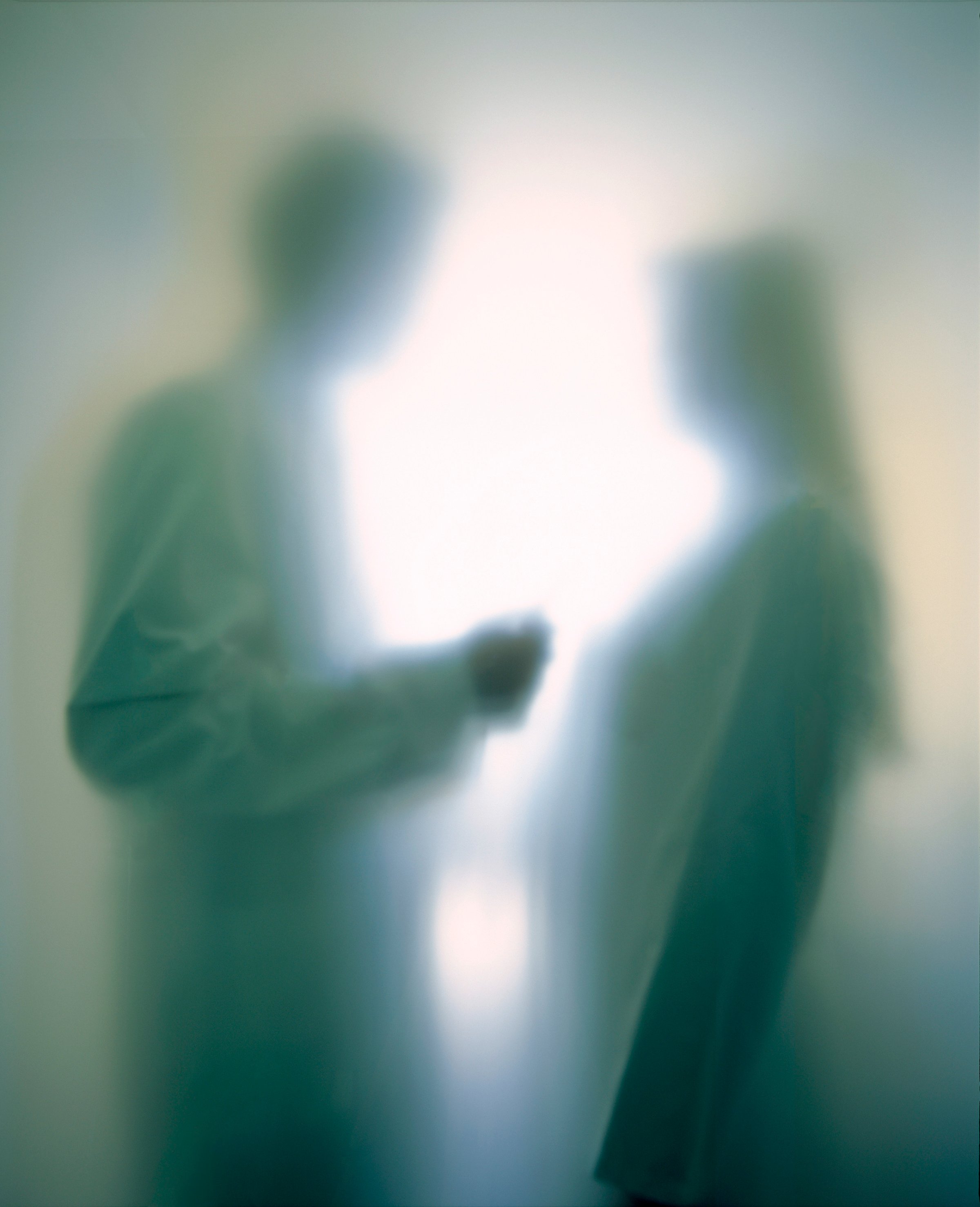 Doctor talking to patient, soft focus