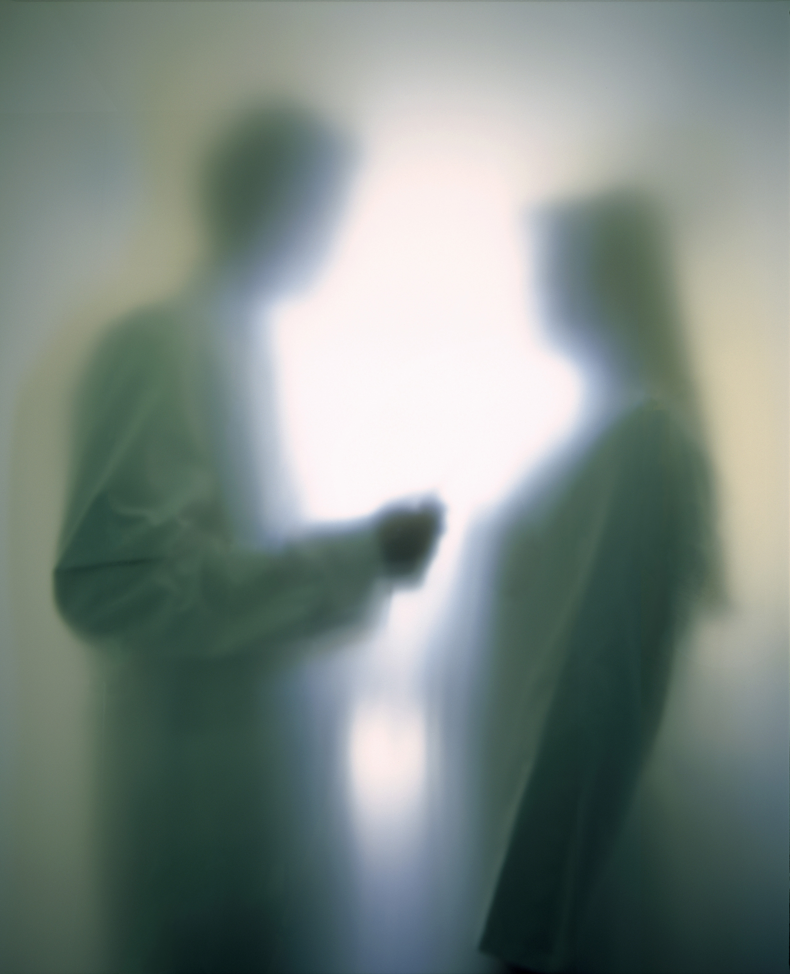 Doctor talking to patient, soft focus