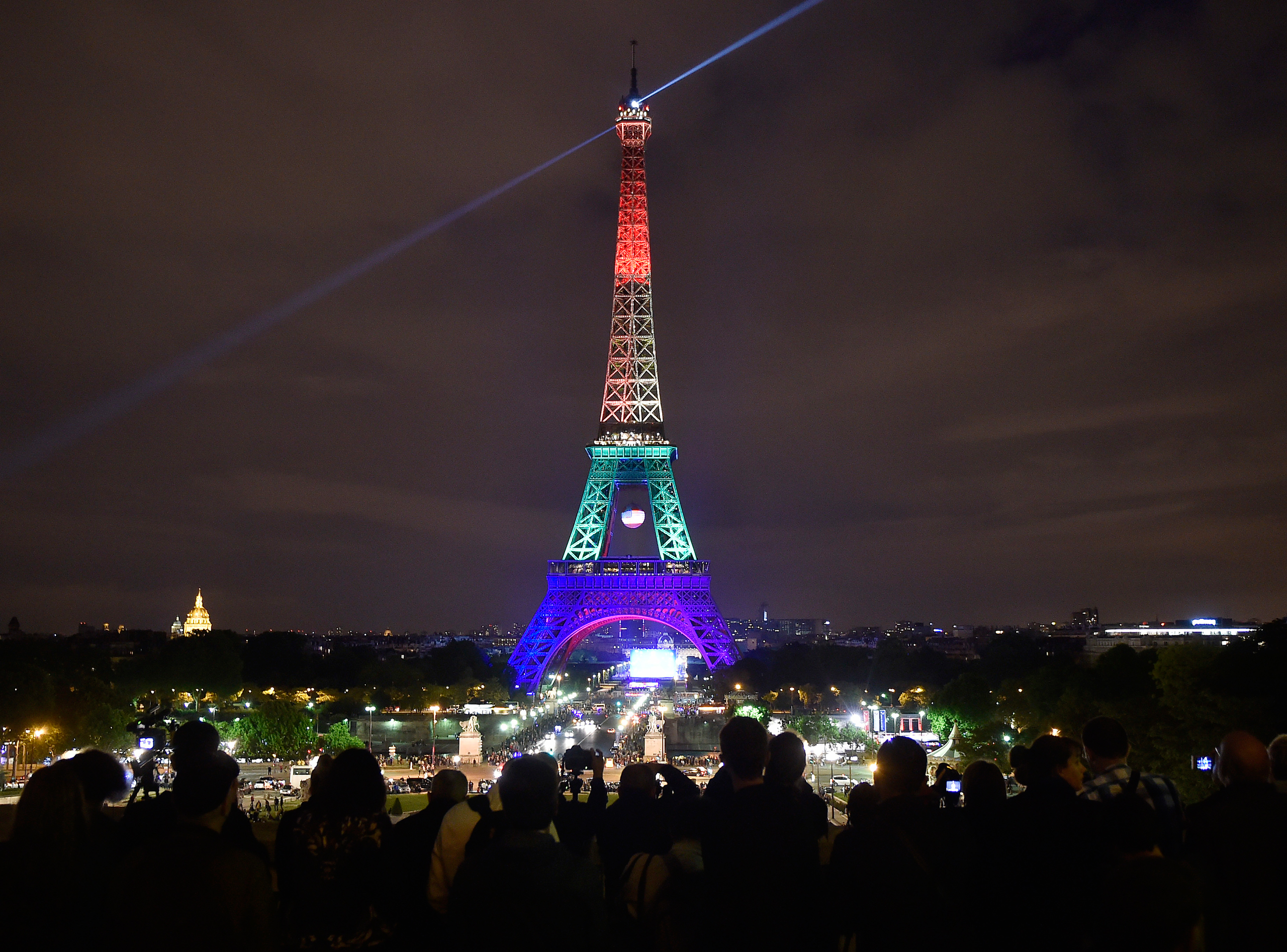 The Eiffel Tower in Paris, France, shines in the colors of a rainbow to honor victims of Sunday's mass shooting at an Orlando gay club on June 13, 2016. (Martin Meissner—AP)