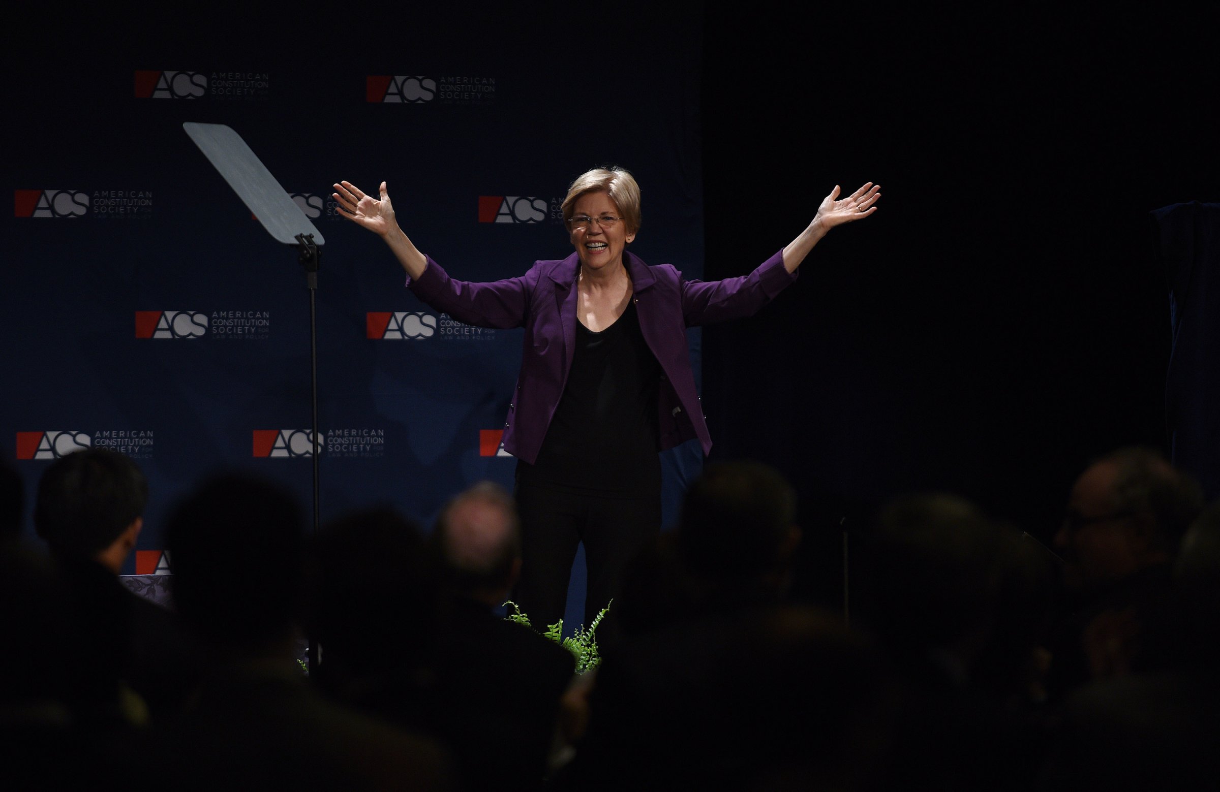 Sen. Elizabeth Warren (D-Mass.) raises her arms after addressing the American Constitution Society 2016 National Convention on June 9, 2016 in Washington, DC. The senator attended the gala dinner of the convention at the Capital Hilton.