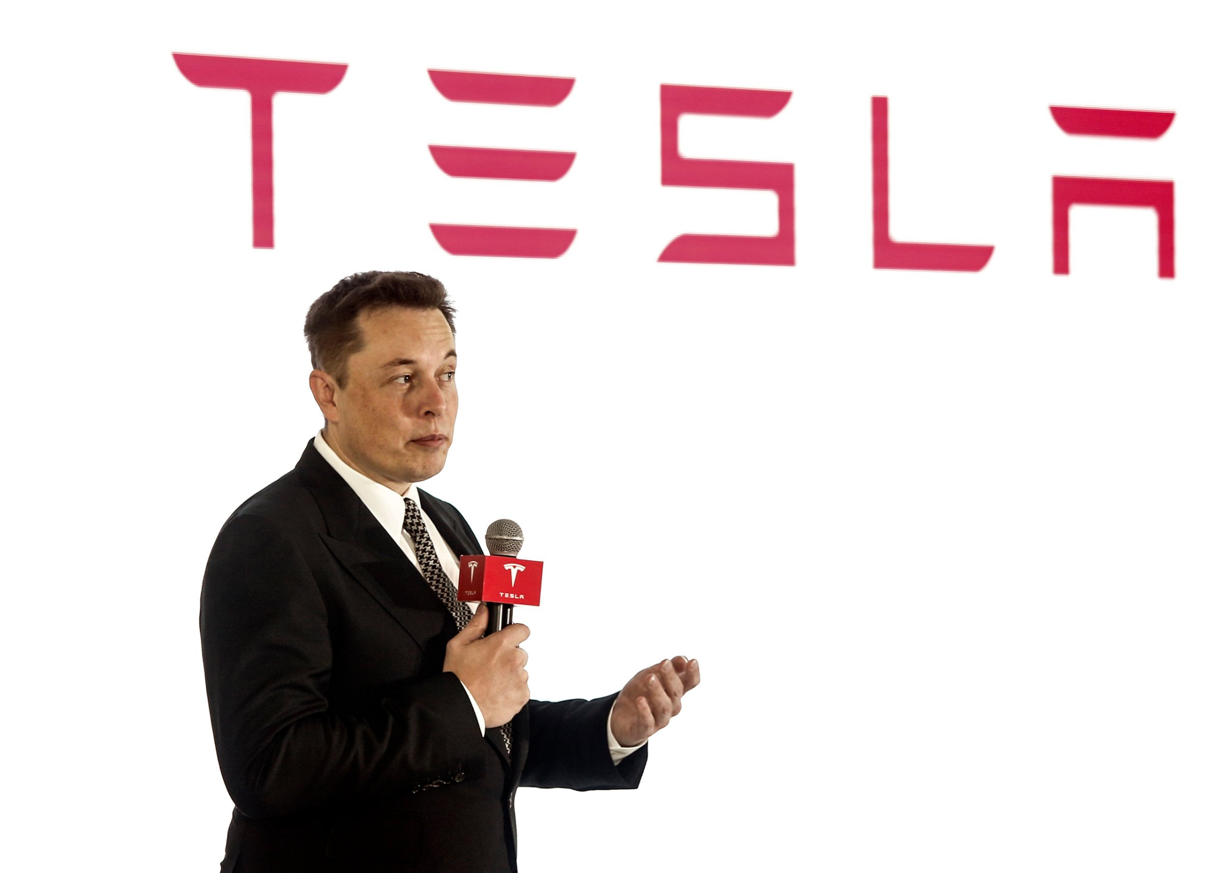 OCTOBER 23: (CHINA OUT) Elon Musk, Chairman, CEO and Product Architect of Tesla Motors, addresses a press conference to declare that the Tesla Motors releases v7.0 System in China on October 23, 2015. in Beijing, China. The v7.0 system includes Autosteer, a new Autopilot feature. While it's not absolutely self-driving and the driver still need to hold the steering wheel and be mindful of road conditions and surrounding traffic when using Autosteer. When set to the new Autosteer mode, graphics on the driver's display will show the path the Model S is following, post the current speed limit and indicate if a car is in front of the Tesla. (Photo by VCG/VCG via Getty Images)