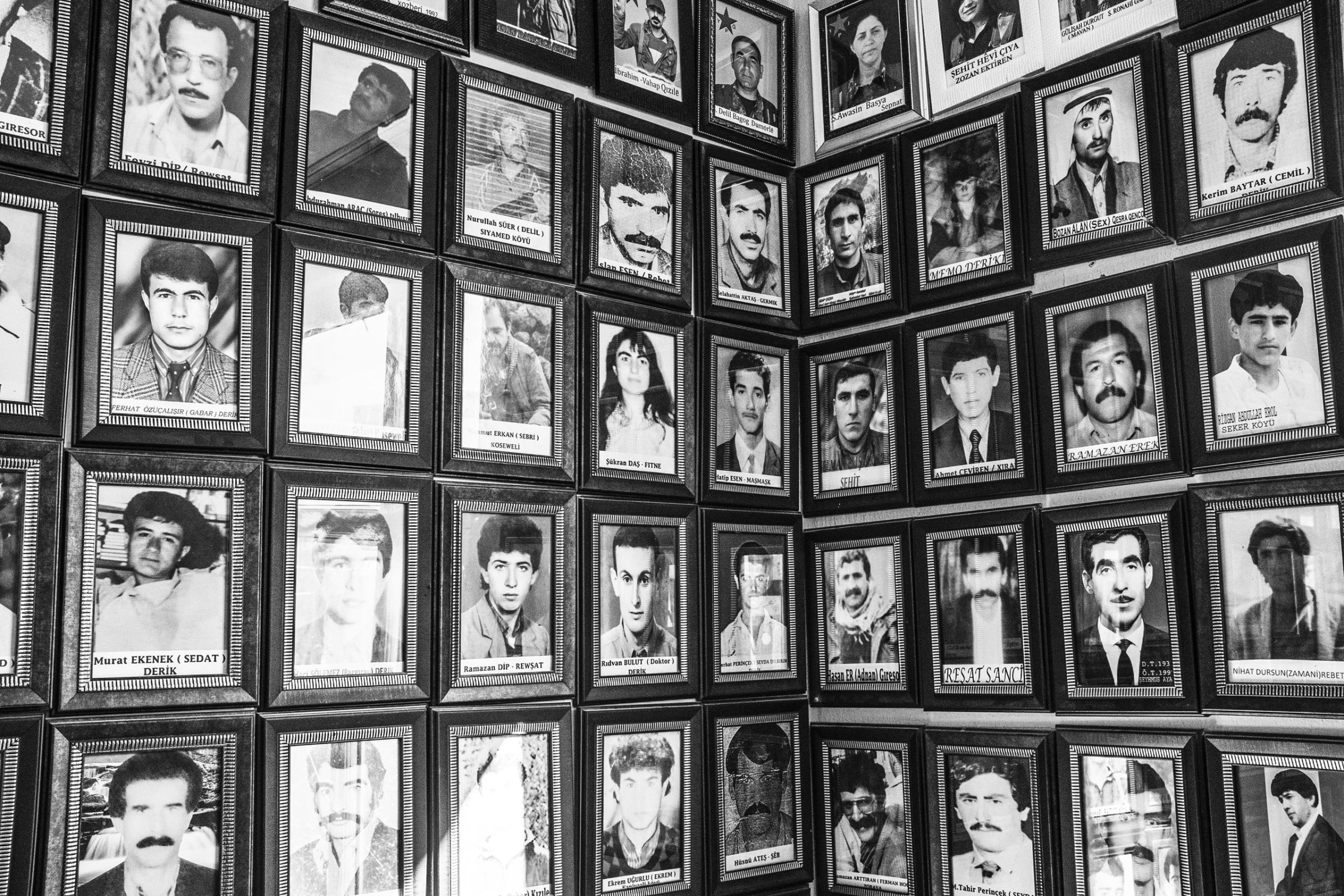 Portraits of Derik's Kurdistan Workers Party (PKK) members who have been killed by Turkish security forces over the last 40 years hang on a wall, Derik, Turkey, Dec. 2015.