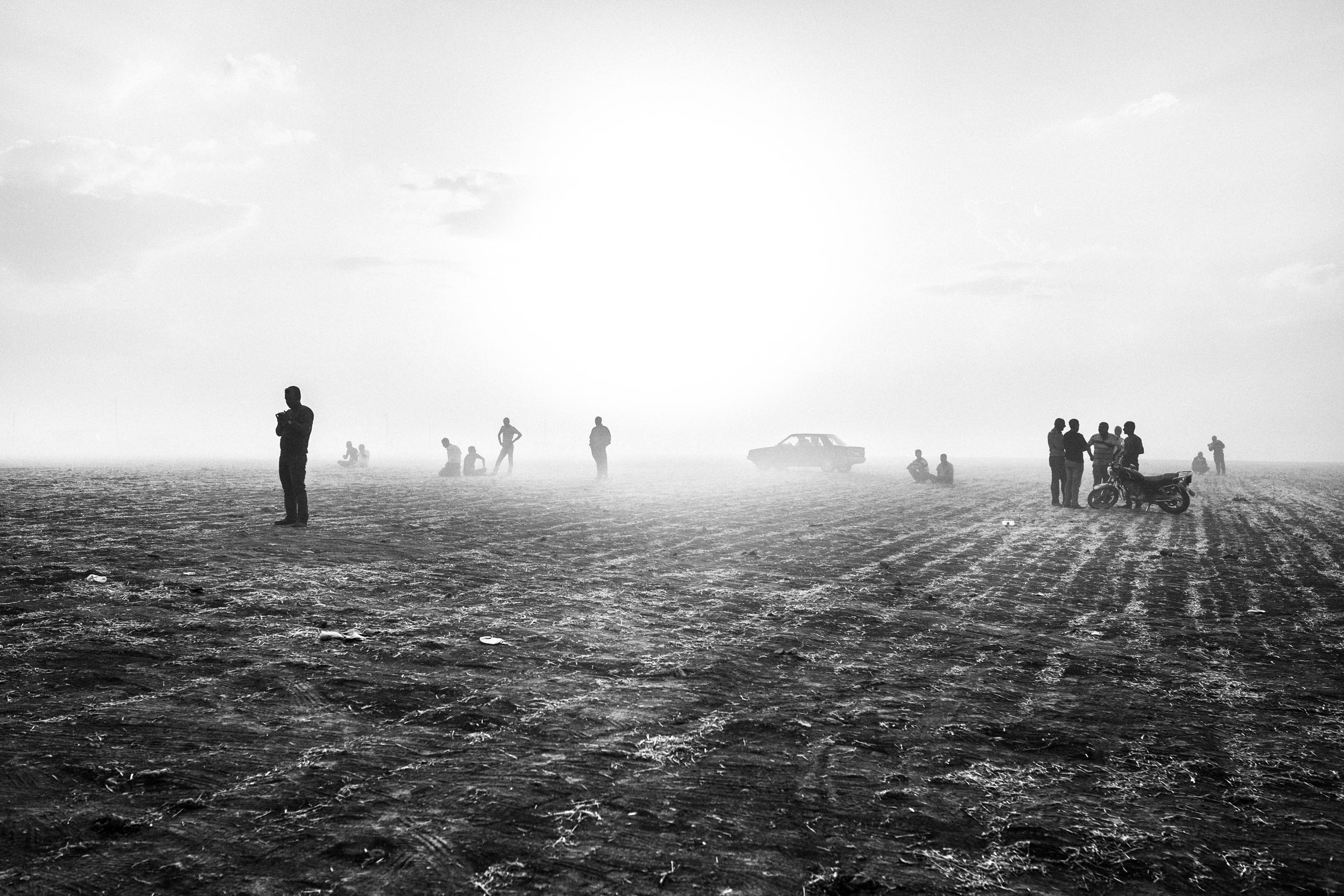 Kurdish Syrian refugees from Kobani, Syria wait near the Turkish-Syrian border, Sept. 2014, as the Islamic State of Iraq and Levant (ISIS/ISIL) began an attack on the city, eventually overtaking it in Oct. 2014. Children and elderly crossed mine fields separating Kobani from the Turkish border, in an effort to flee the fighting. According to UNHCR, 170,000 inhabitants of Kobani took refuge in the camps in Turkey.