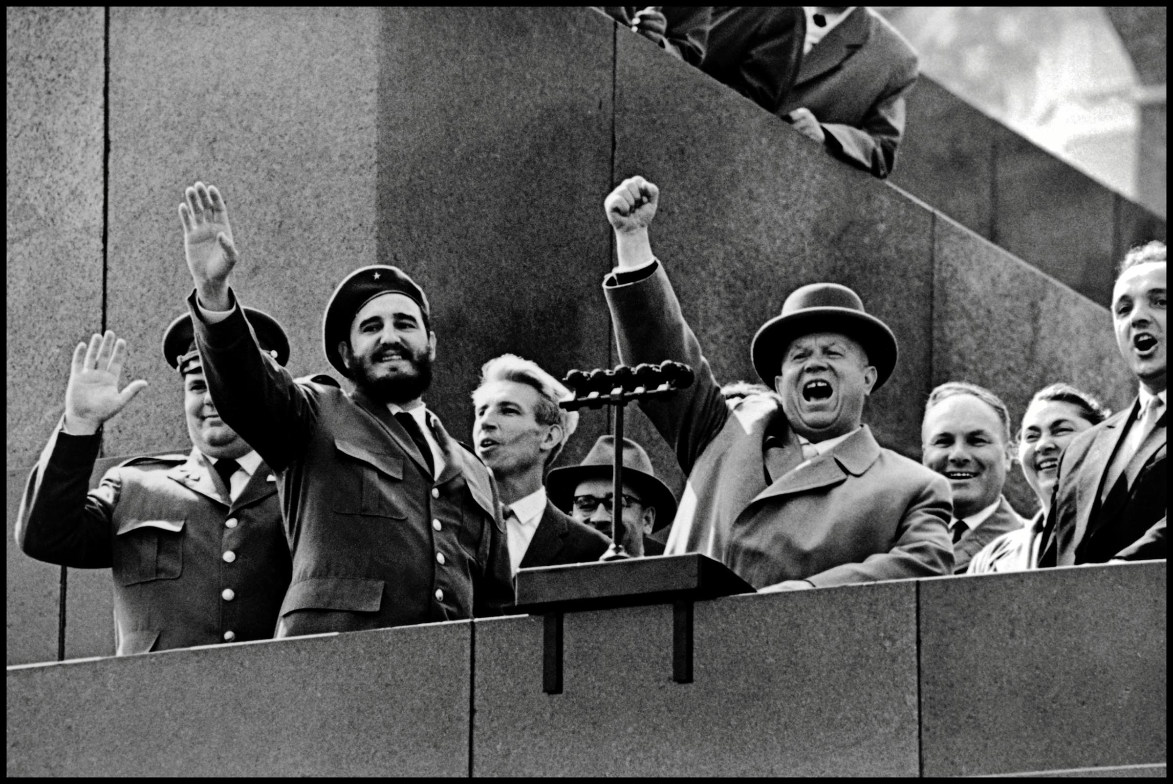 At the height of the Soviet-Cuban cooperation, Nikita Khrushchev welcomes Cuban President Fidel Castro at the podium of the Kremlin in front of the Red Square in Moscow, 1961.