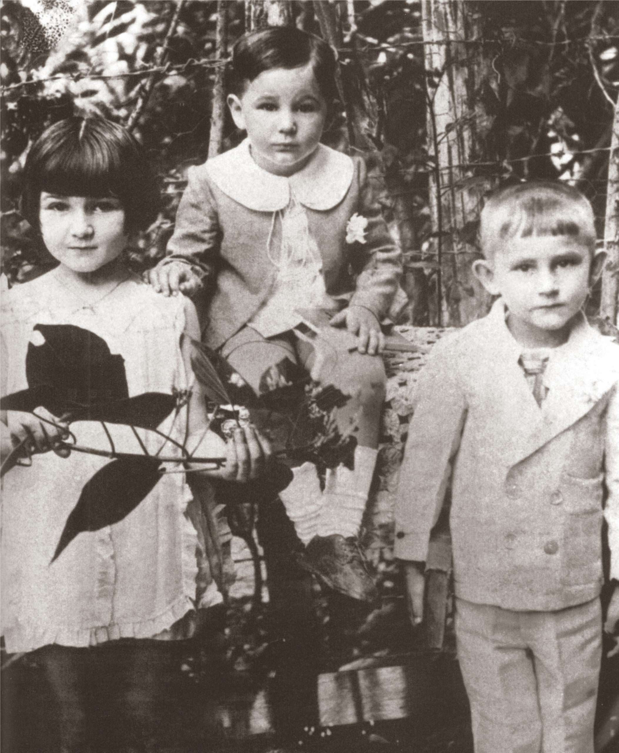 Fidel Castro, age 3, is seated in between his sister, Angelita, 6, and brother Ramon, 4, in 1929.