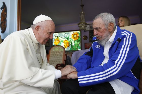 Pope Francis and Fidel Castro embrace hands at a 40-minute meeting inside Castro's residence during the pontiff's trip to Havana on Sept. 20, 2015.
